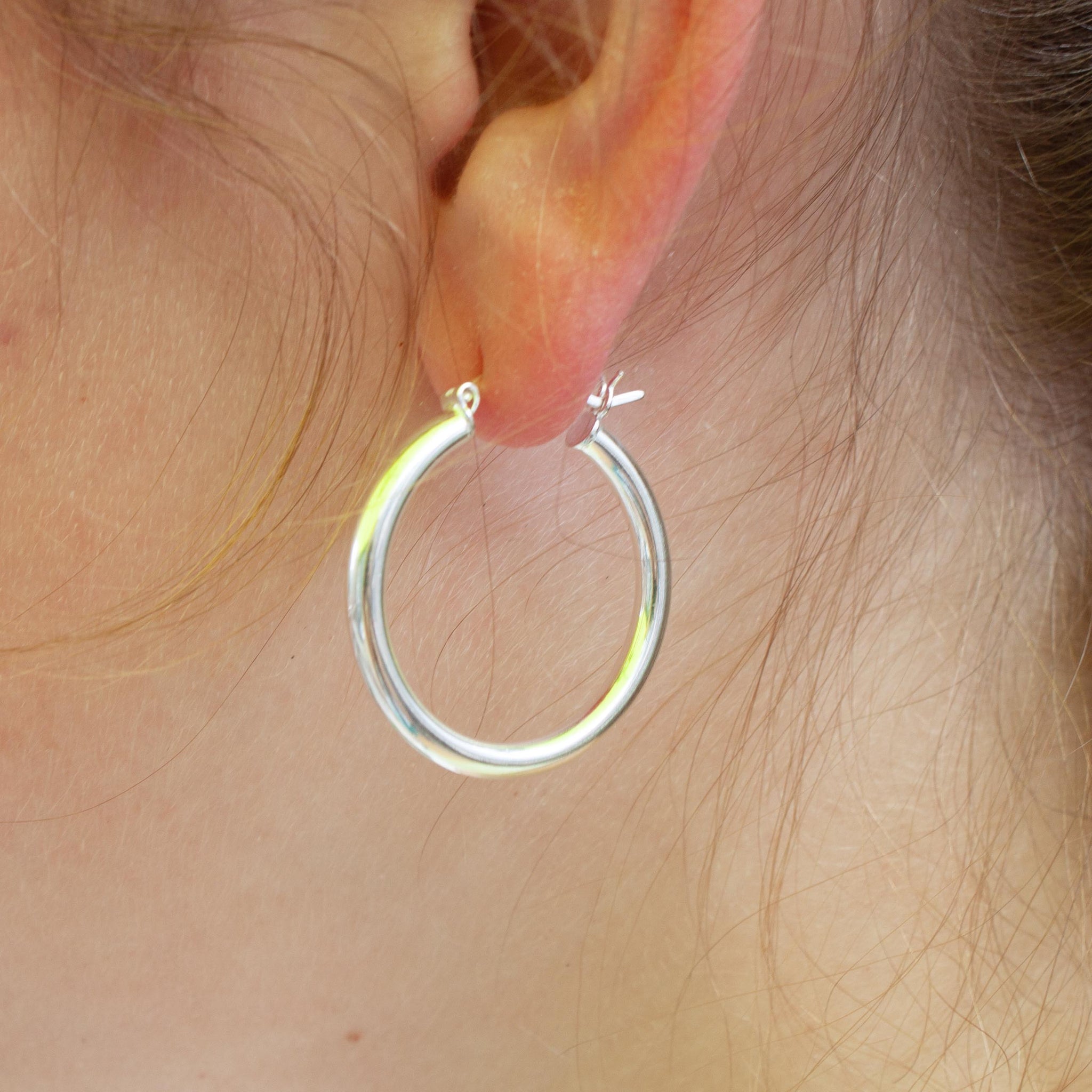 Make a statement with these substantial yet delicate silver hoops.  sterling silver hoop earrings.  25mm diameter. kp jewelry co.