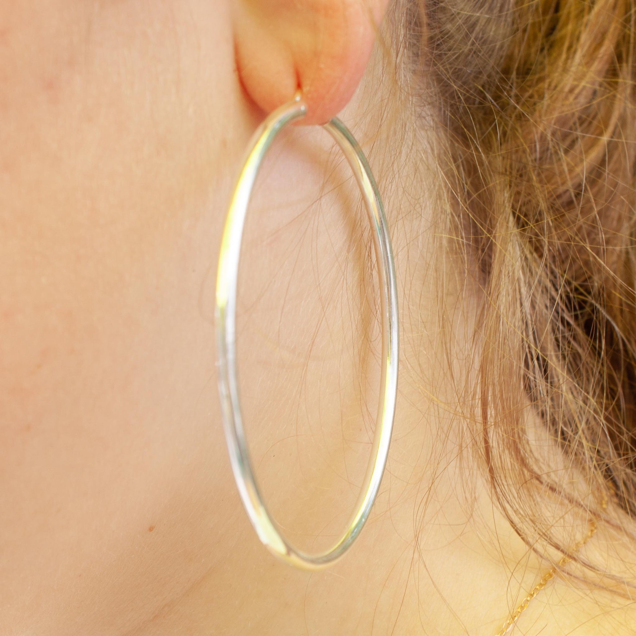 The biggest of the big! Make a statement with these substantial silver hoops.  sterling silver hoop earrings.  60mm diameter. kp jewelry co.