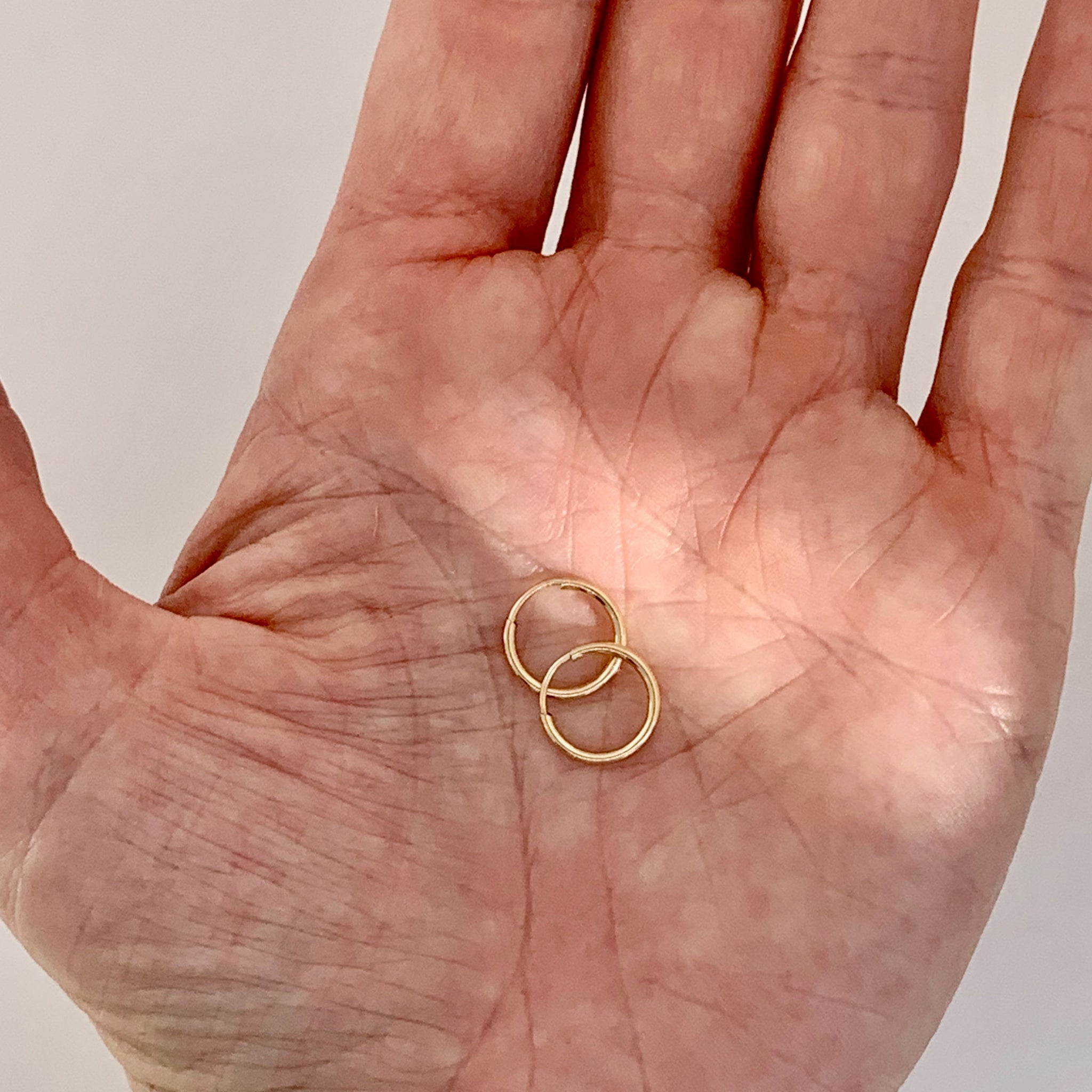 Delicate gold hoops.  Gold-filled hoop earrings. 10mm diameter by kp jewelry co.