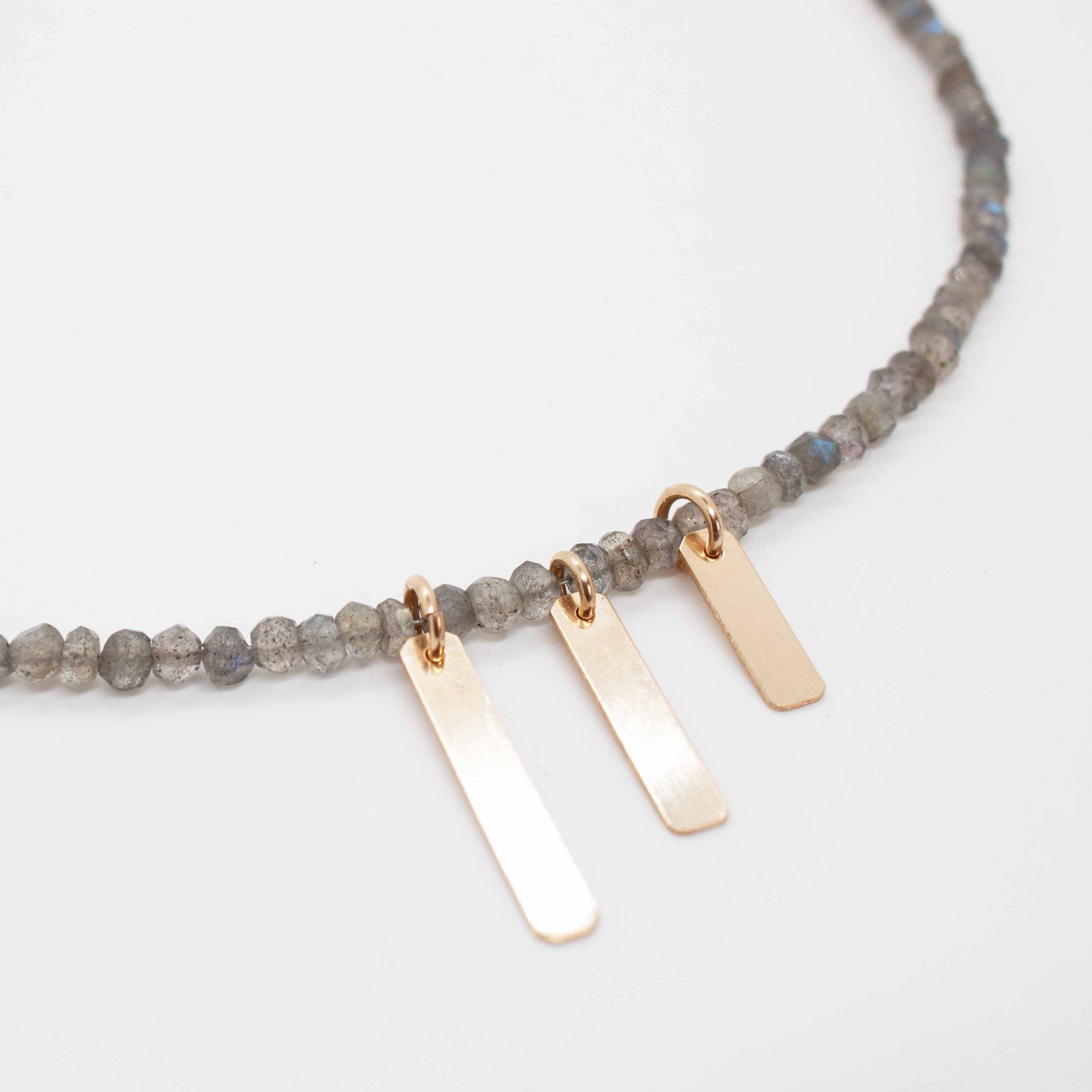 16 inch (adjustable to 18 inches) beaded labradorite necklace with cascading gold filled bars and lobster clasp.
