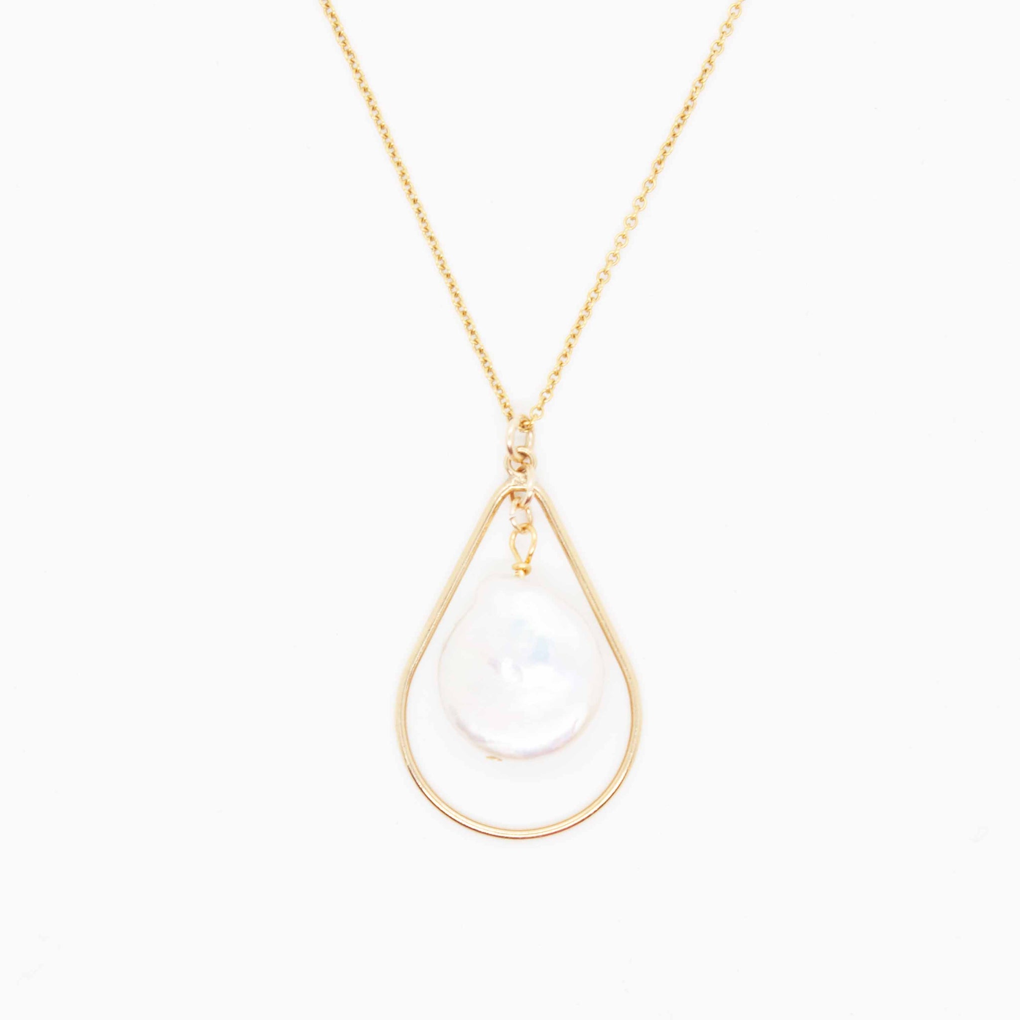 Designed with inspiration from a fellow fearless female, Lisa's necklace offers a modern shape with a classic pearl to freshen up your everyday! 16, 18 or 20 inch gold filled necklace with 1 1/4 inch gold filled teardrop pendant and keshi pearl. Handmade in by Toronto kp jewelry co.