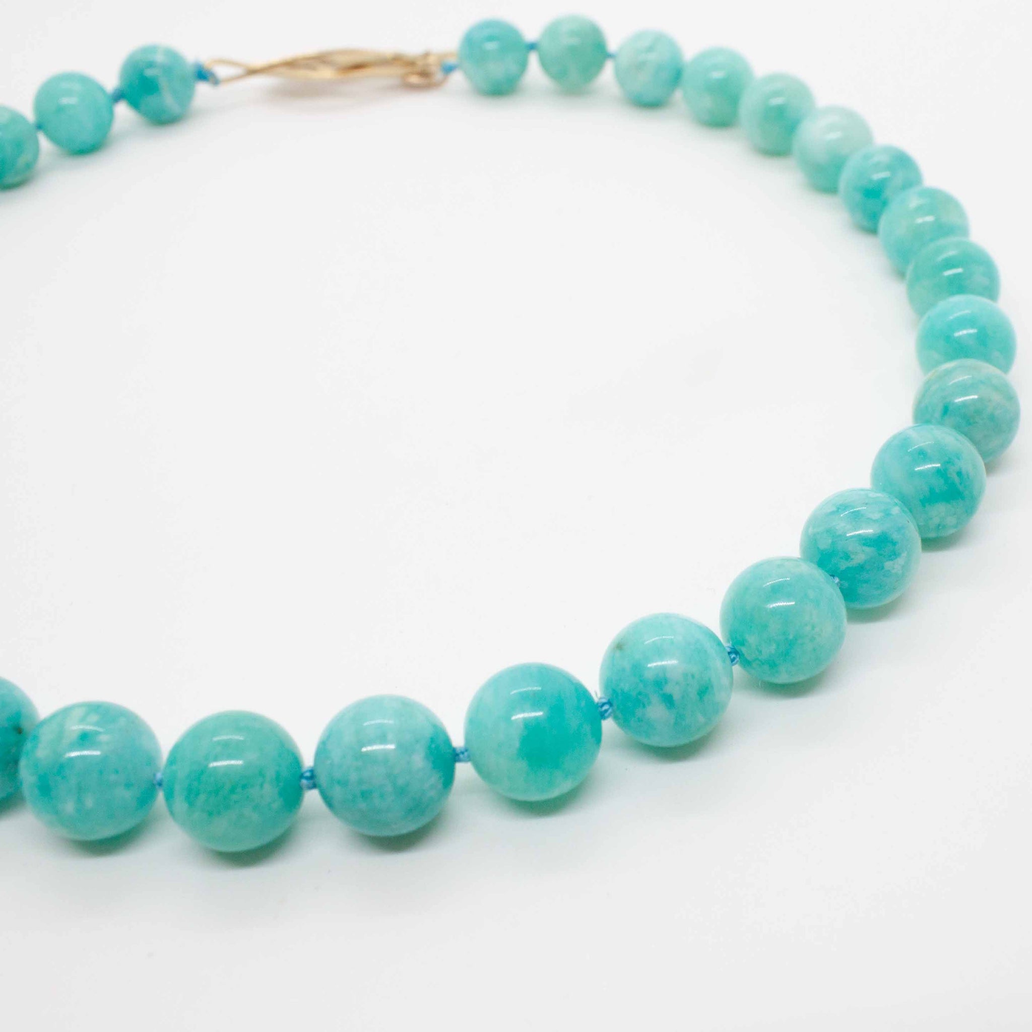 A kp jewelry co. staple! The amazonite collar is the best representation of all that we love about making jewelry: our favourite colour, our favourite technique (hand knotting) and a strong clasp with personality. Love it but want it in a longer length? Just let us know! 16 or 18 inch hand knotted amazonite necklace with gold vermeil leaf clasp. Handmade in Toronto by kp jewelry co.