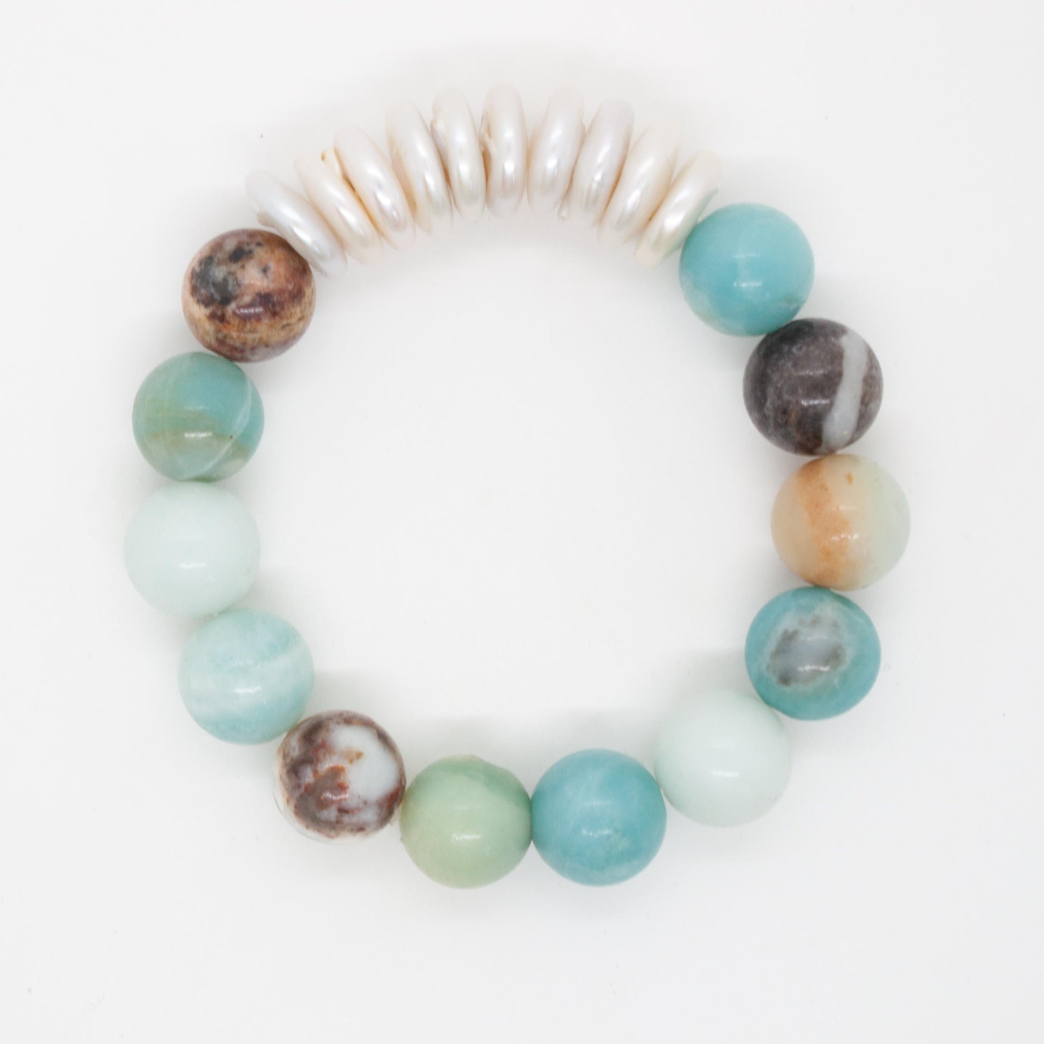 Subdued, earthy tones of black & gold amazonite with lustrous keshi pearls. 7 inch beaded amazonite stretchy bracelet with keshi pearls, double strung with silk elastic cord handmade in Toronto kp jewelry co.