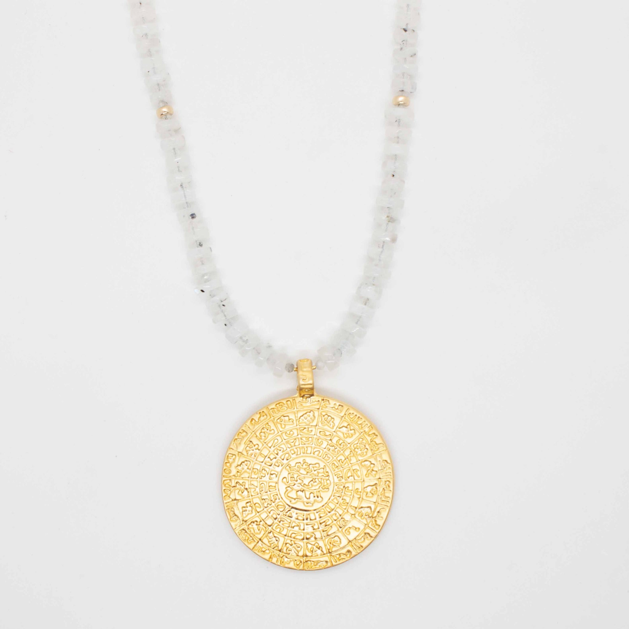 Sparkling black and white moonstone is paired perfectly with a striking golden coin pendant in this delicate and distinguished piece.  20 inch necklace, beaded with black & white moonstone and oversized golden coin pendant gold-filled spring ring clasp handmade in Toronto kp jewelry co.