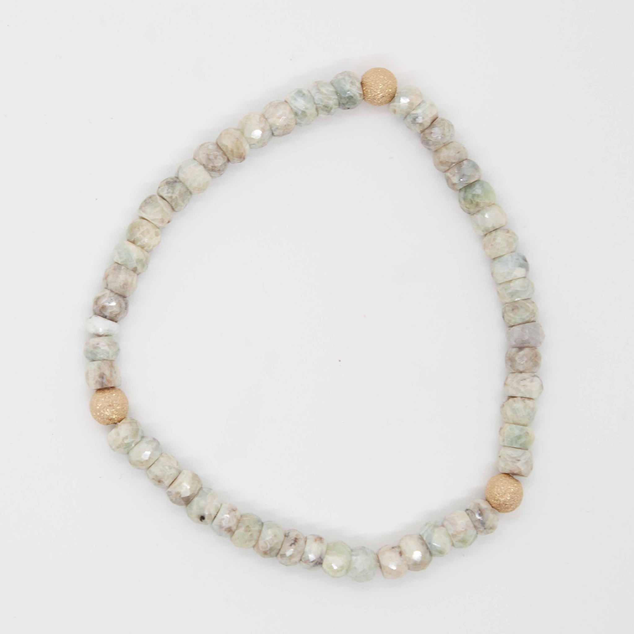 7 inch beaded silverite stretchy bracelet with 14kt gold filled accent beads.