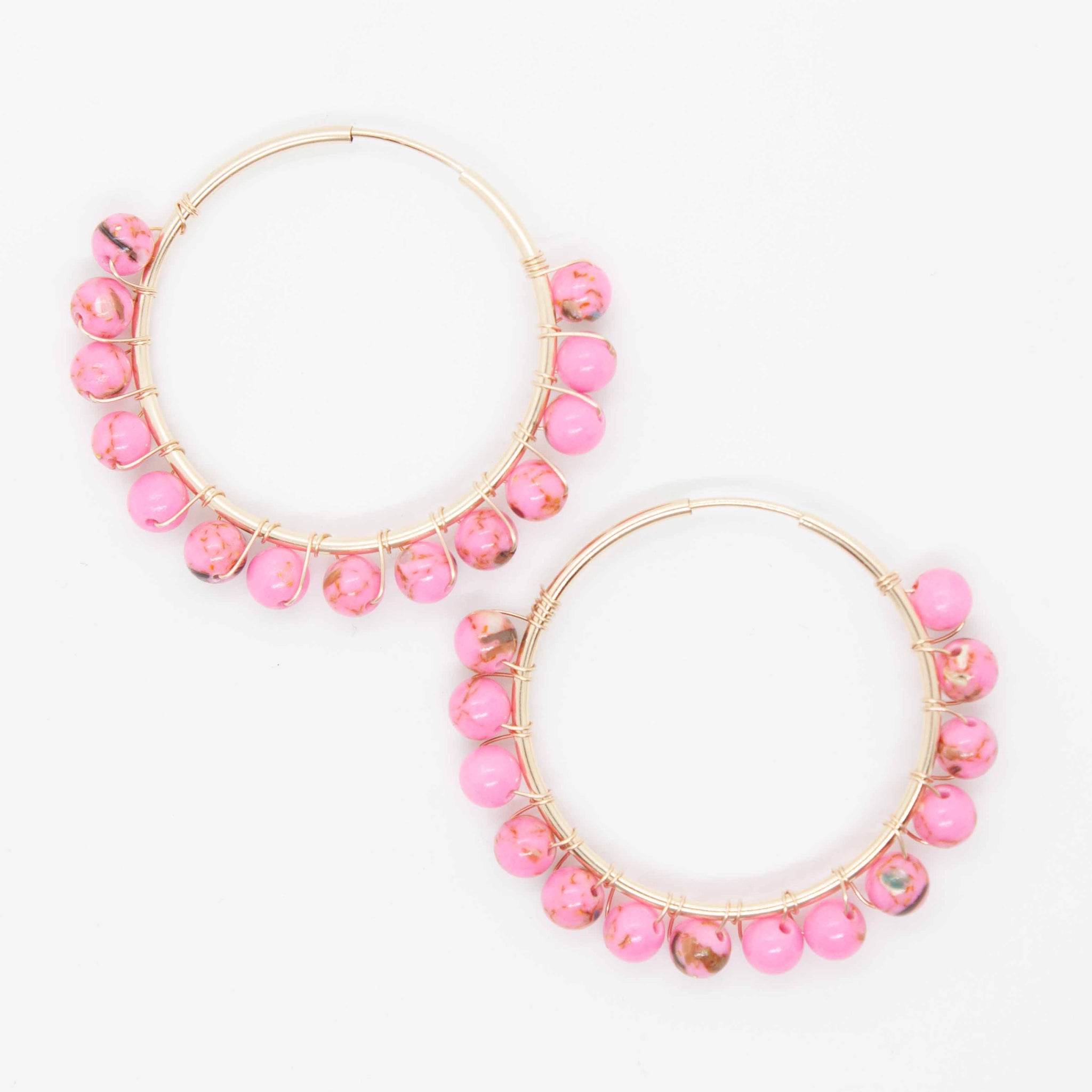 Cute and bubbly hoops to adorn your sweet lobes this summer!  30mm gold filled hoop earrings and pink beads wrapped with gold wire. Handmade in Toronto by kp jewelry co.