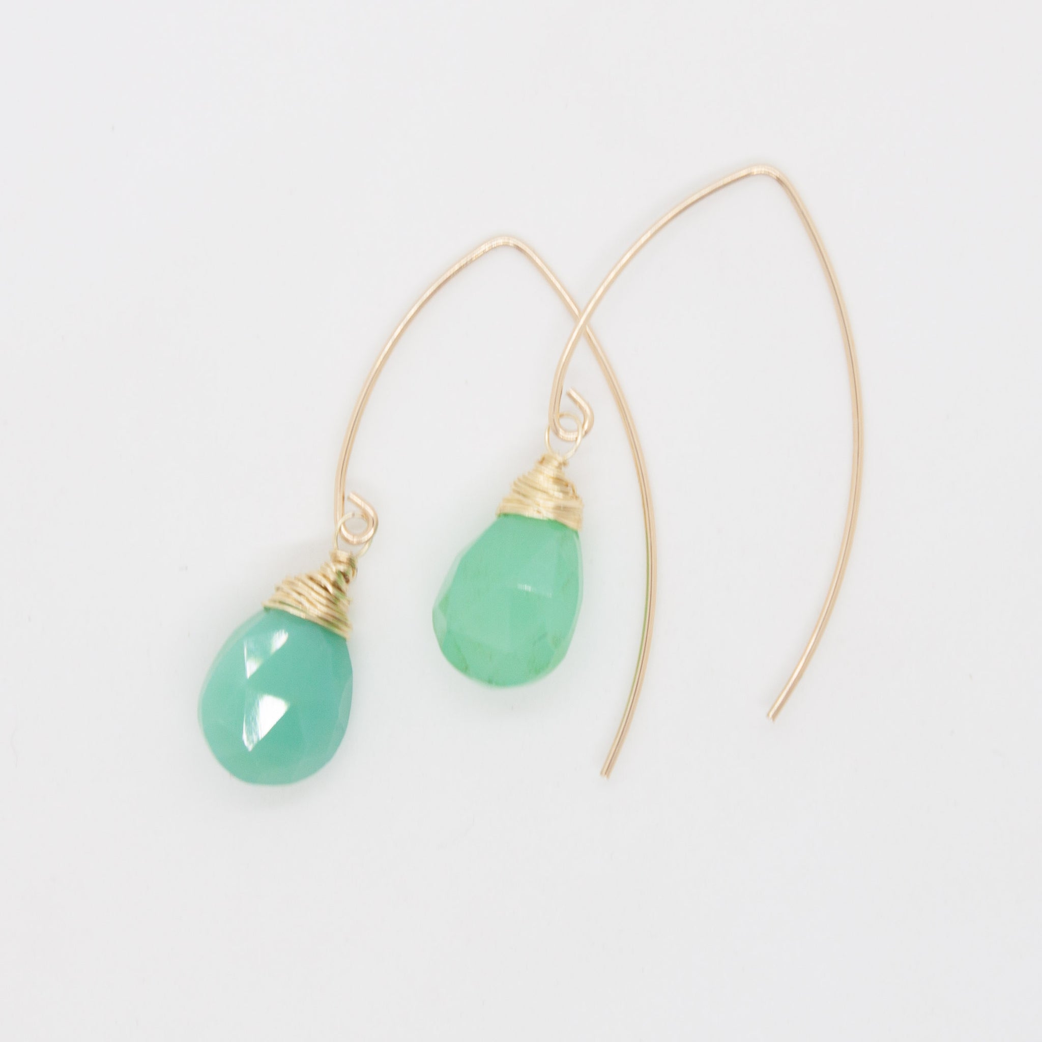 Bring joy, hope and happiness to your pretty lobes this summer with these delicate chrysoprase drops wrapped in gold. 1 inch earrings made with faceted, pear-shaped chrysoprase briolettes, wrapped in 14 karat gold wire on gold-filled earring hooks. Hypo-allergenic and sensitive ear friendly. Handmade in Toronto by kp jewelry co.