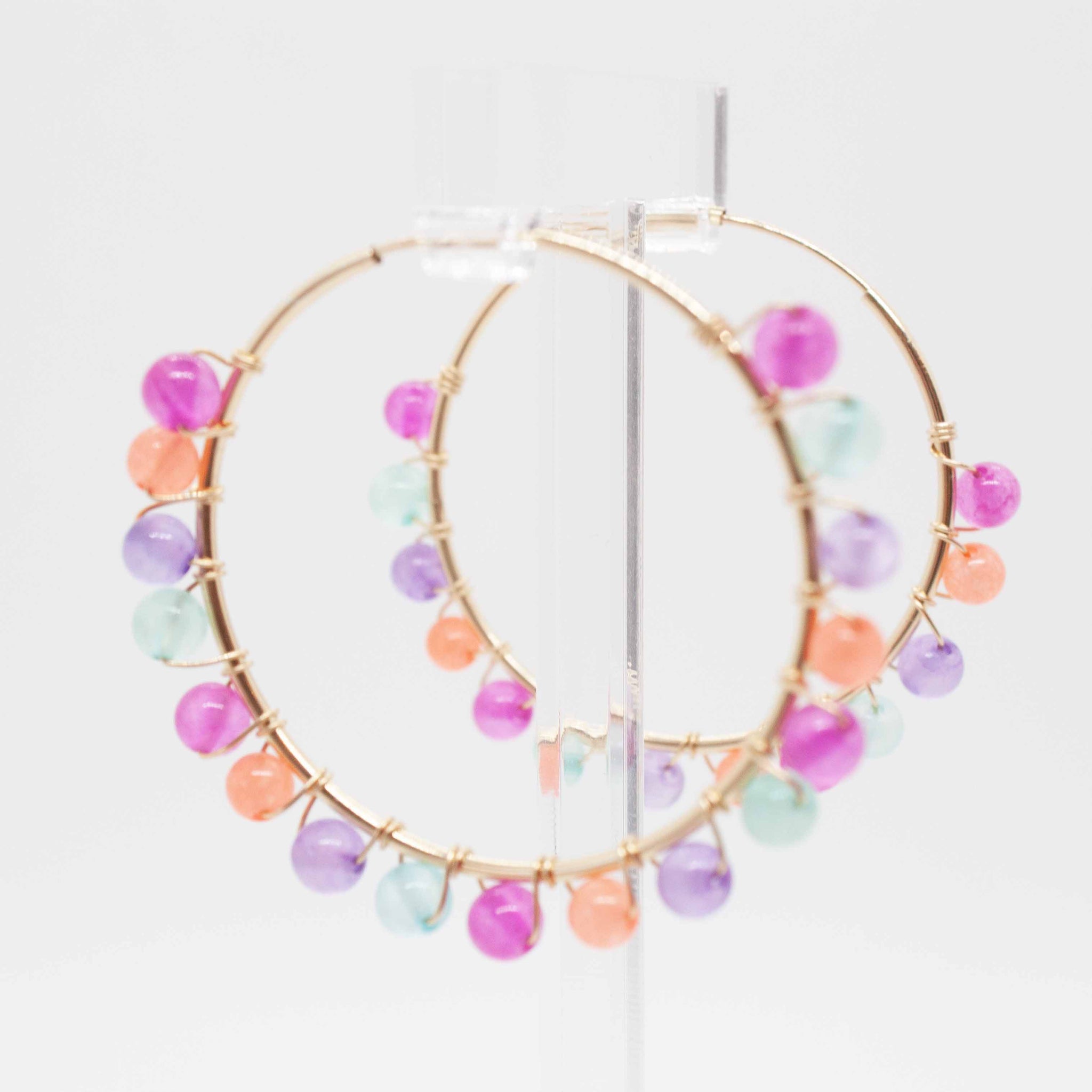 Bodacious ear candy to crank up your Zoom calls this summer! 40mm gold filled hoop earrings and fuschia, tangerine, violet and aqua beads wrapped with gold wire. Handmade in Toronto by kp jewelry co.
