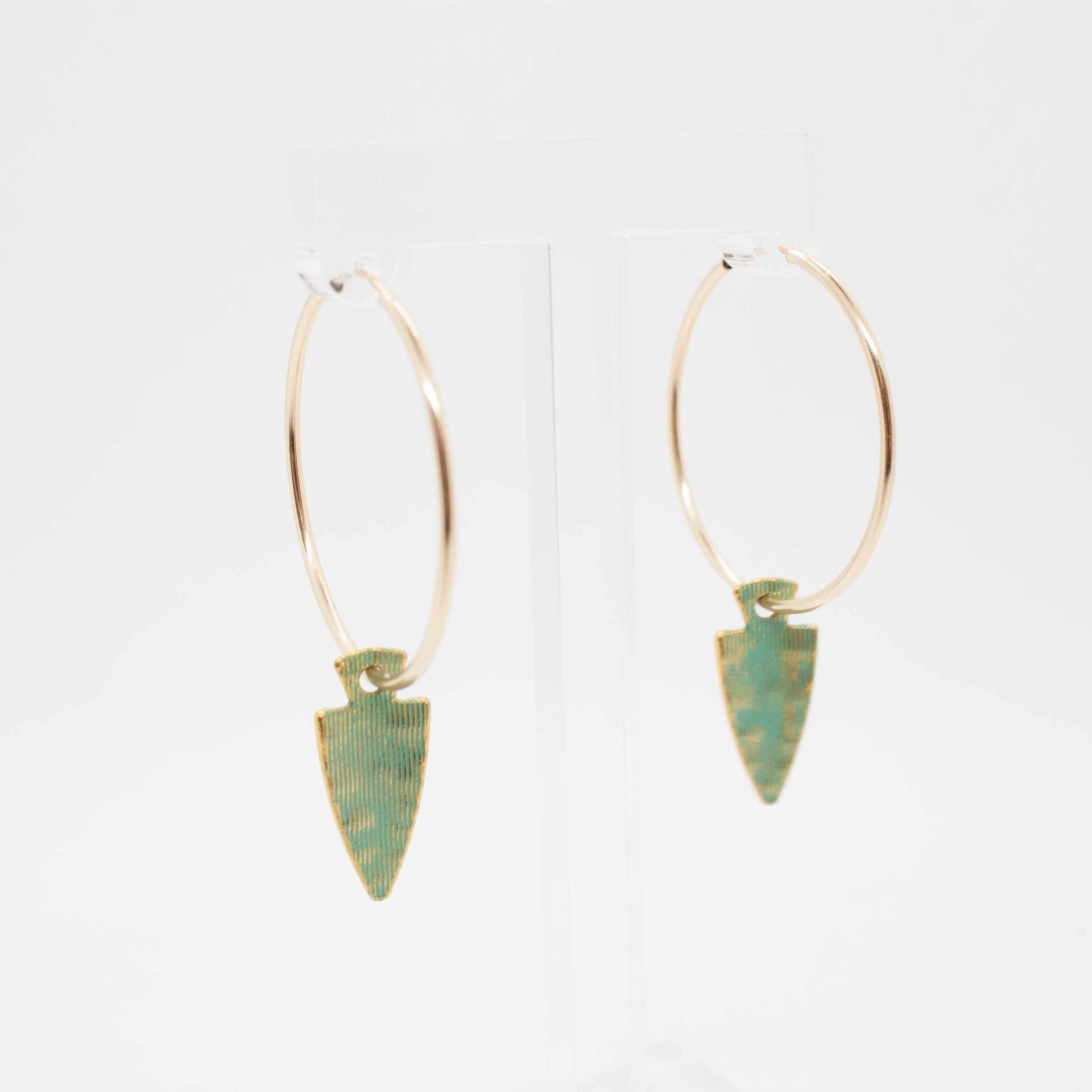 Get ready for battle in these turquoise and gold beauties! 40mm gold filled hoop earrings with vintage arrow head charms. Made in Toronto kp jewelry co.