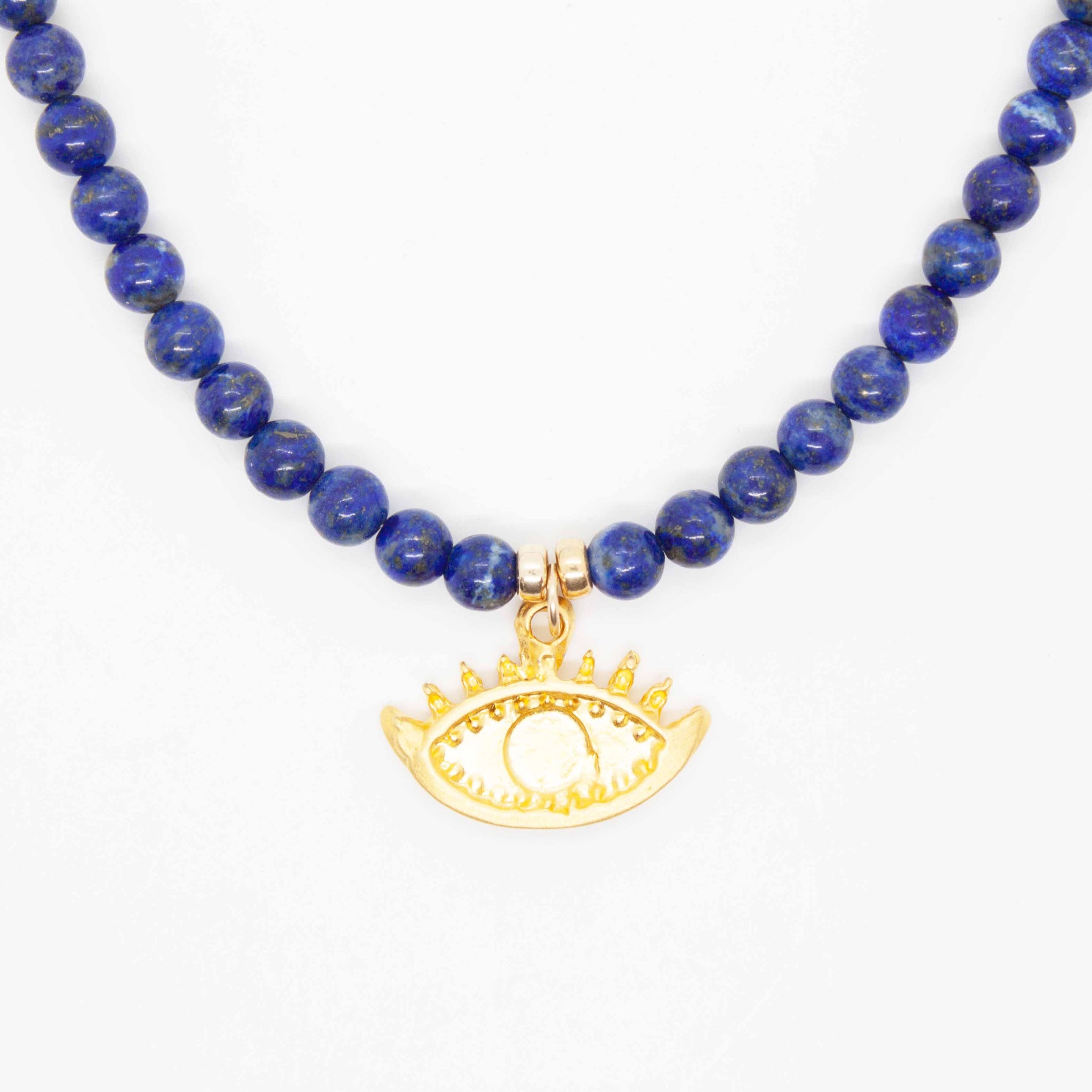 A universal symbol of protection, the evil eye talisman dates back to ancient Greece. This charm is paired with lapis lazuli, which is also believed to provide protection and shield the wearer from negative influences. 16 inch beaded lapis necklace with evil eye charm and gold filled spring ring clasp. Handmade in Toronto by kp jewelry co.