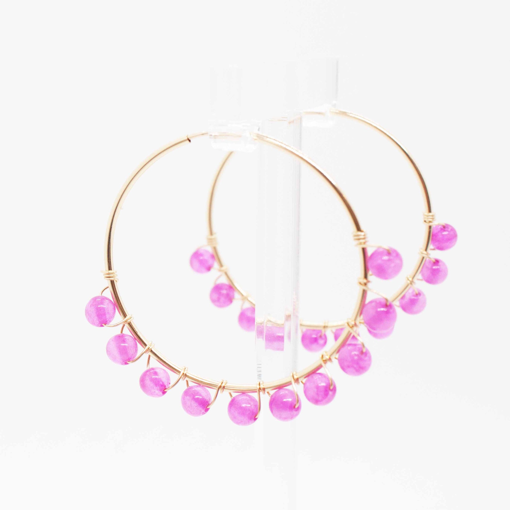 Bodacious ear candy to crank up your Zoom calls this summer!  40mm gold filled hoop earrings and fuchsia beads wrapped with gold wire. Handmade in Toronto.