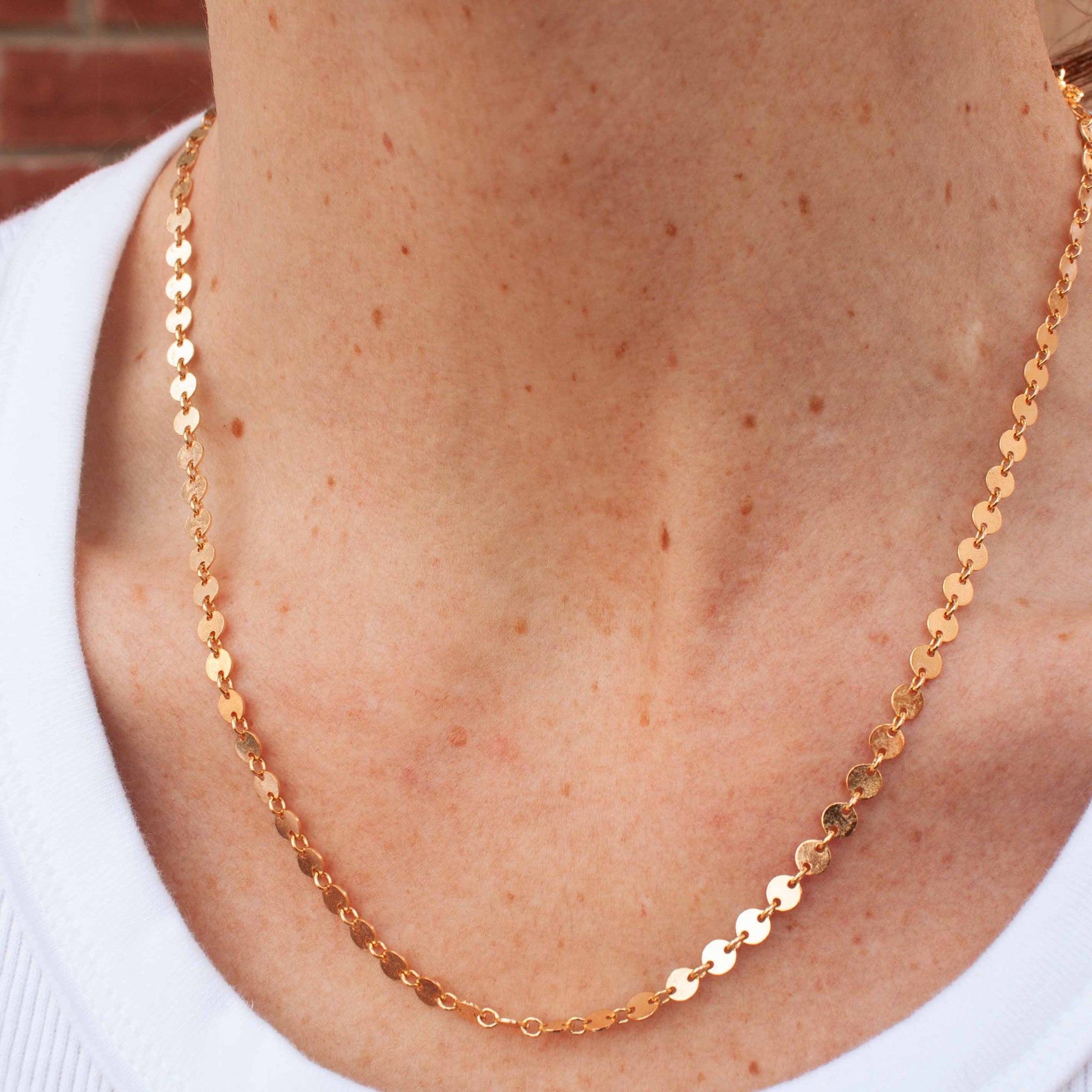 For LOVE of simplicity and classic elegance. 16 or 18 inch 14 karat gold filled* coin link chain. *Gold-filled jewelry is composed of a solid layer of gold, mechanically bonded to sterling silver. you are fine to shower in it, get it wet, wear it for life! kp jewelry co.