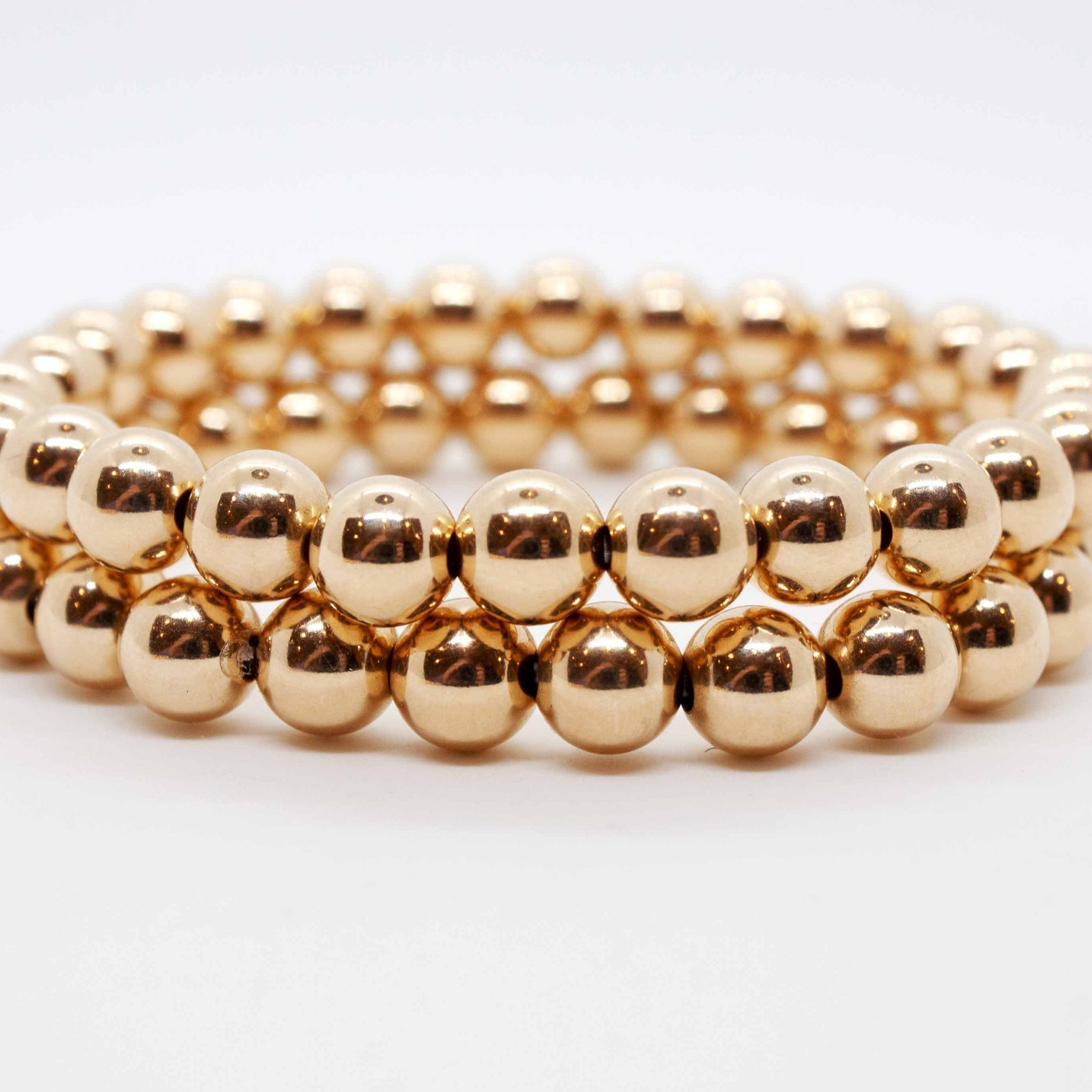 7 inch beaded gold stretchy stacking bracelet.