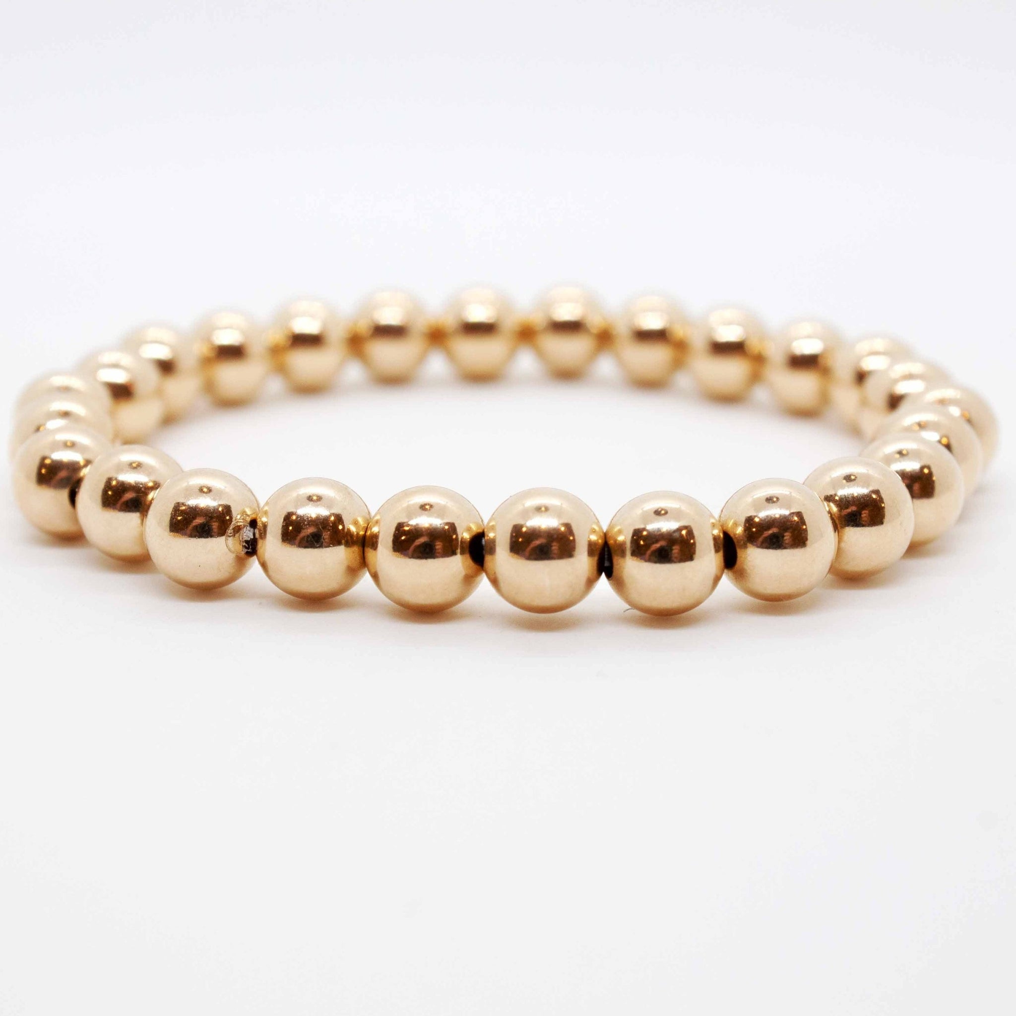 7 inch beaded gold stretchy stacking bracelet.