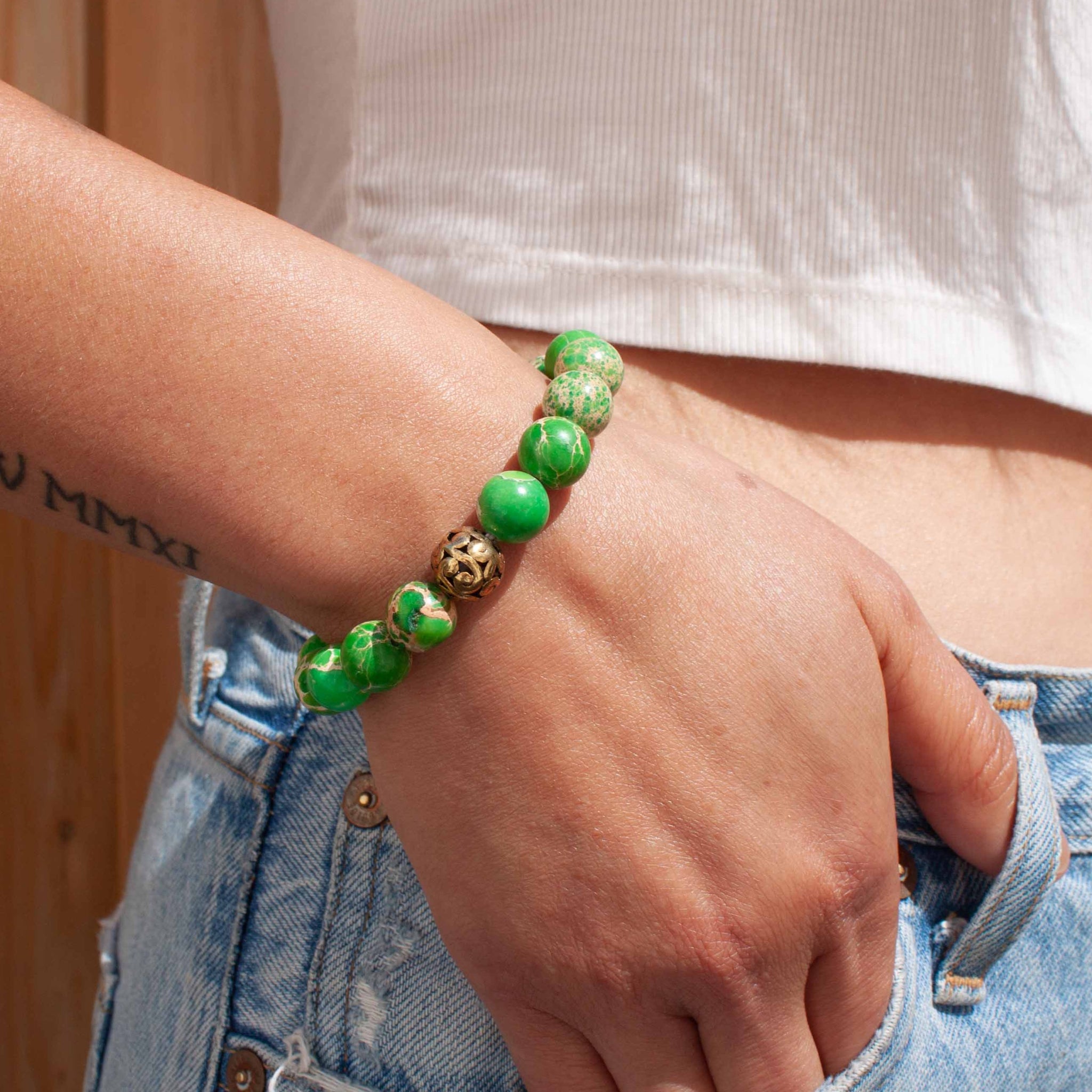 Ah green, the colour of life, renewal and nature. Pop this baby on your wrist to show the world your energy and vitality! 7 inch bracelet made with emperor green jasper beads, along with brass accents, double strung with silk elastic. Handmade in Toronto by kp jewelry co.