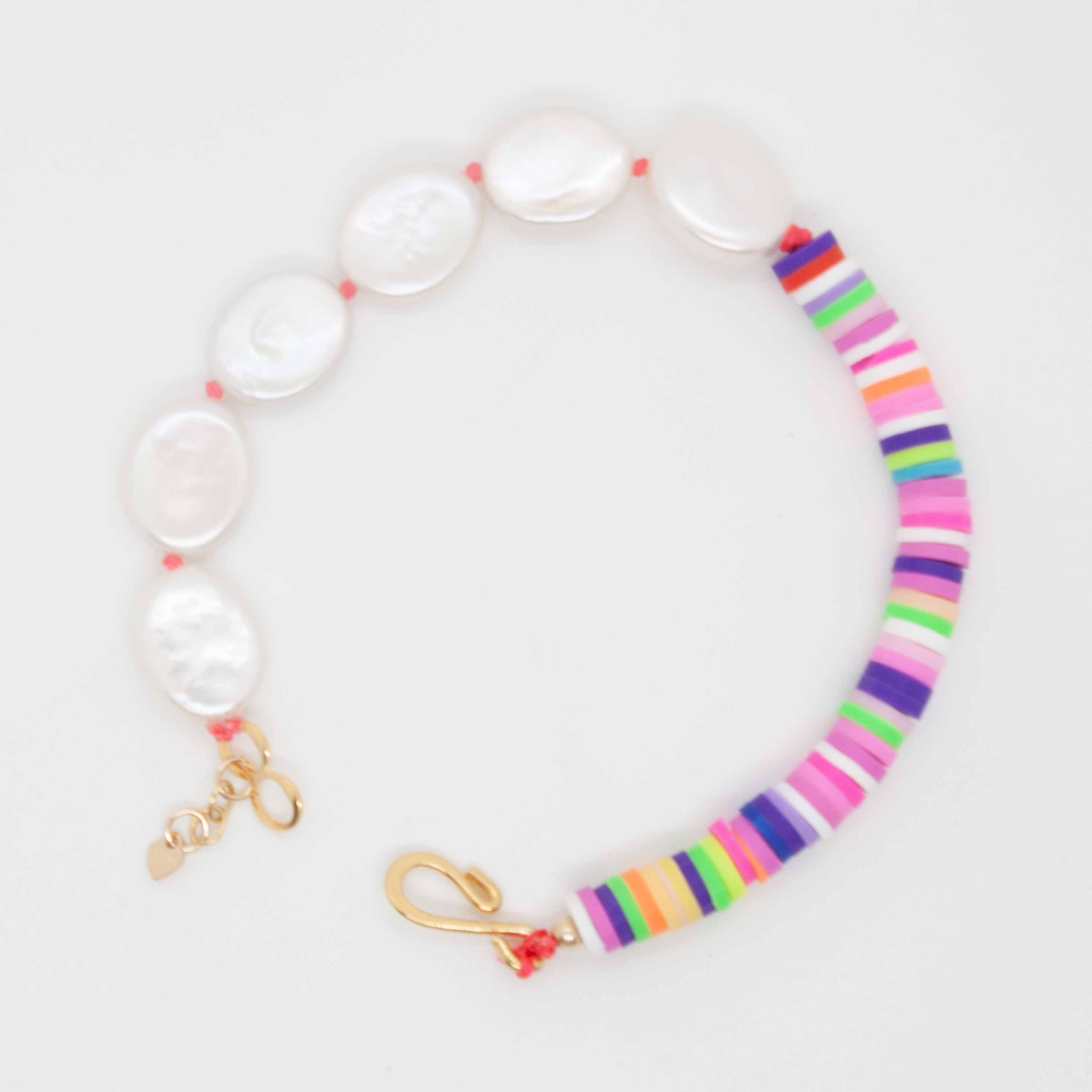 Surprise those traditional pearls with a pop of fun-loving colour! 20 inch (adjustable to 22 inches) hand knotted pearl necklace with multicolour vinyl heishi beads. Handmade in Toronto by kp jewelry co.
