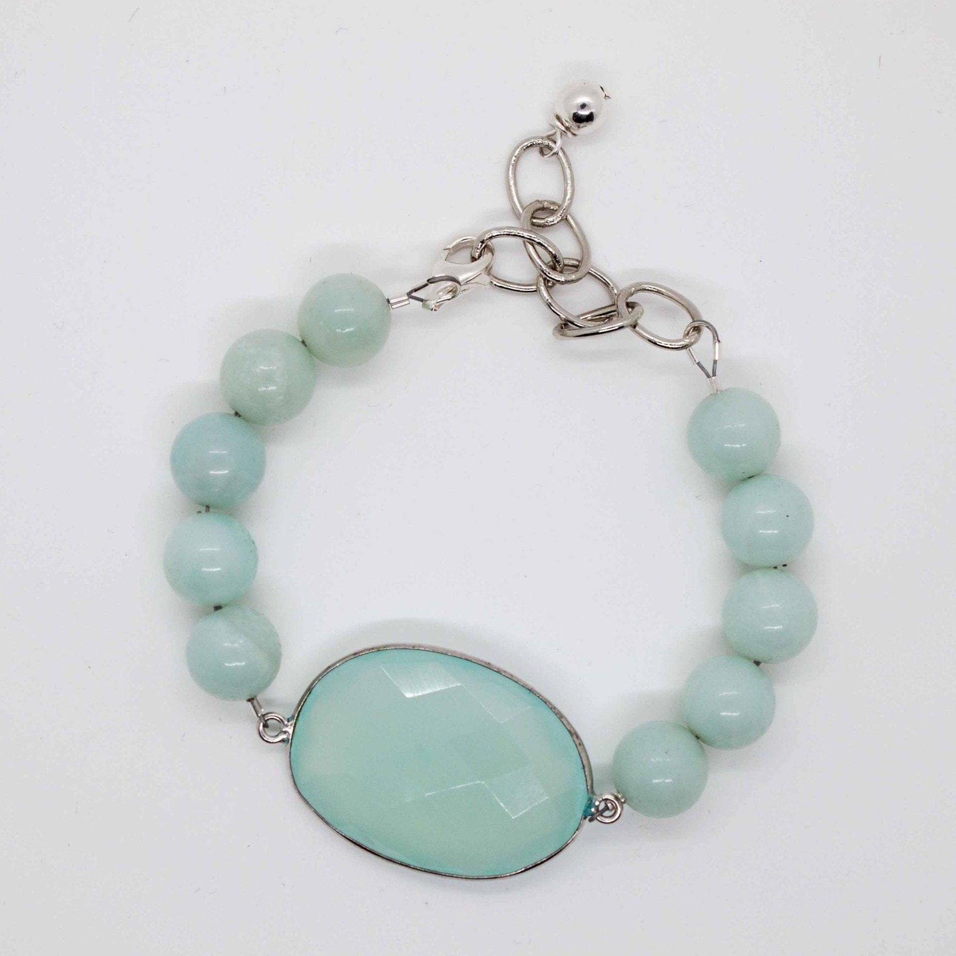 Cadence bracelet stack: 3 beaded bracelets made from crystal, sterling silver and amazonite. Amazonite bracelet has large chalcedony pendant and adjustable sterling silver lobster clasp.