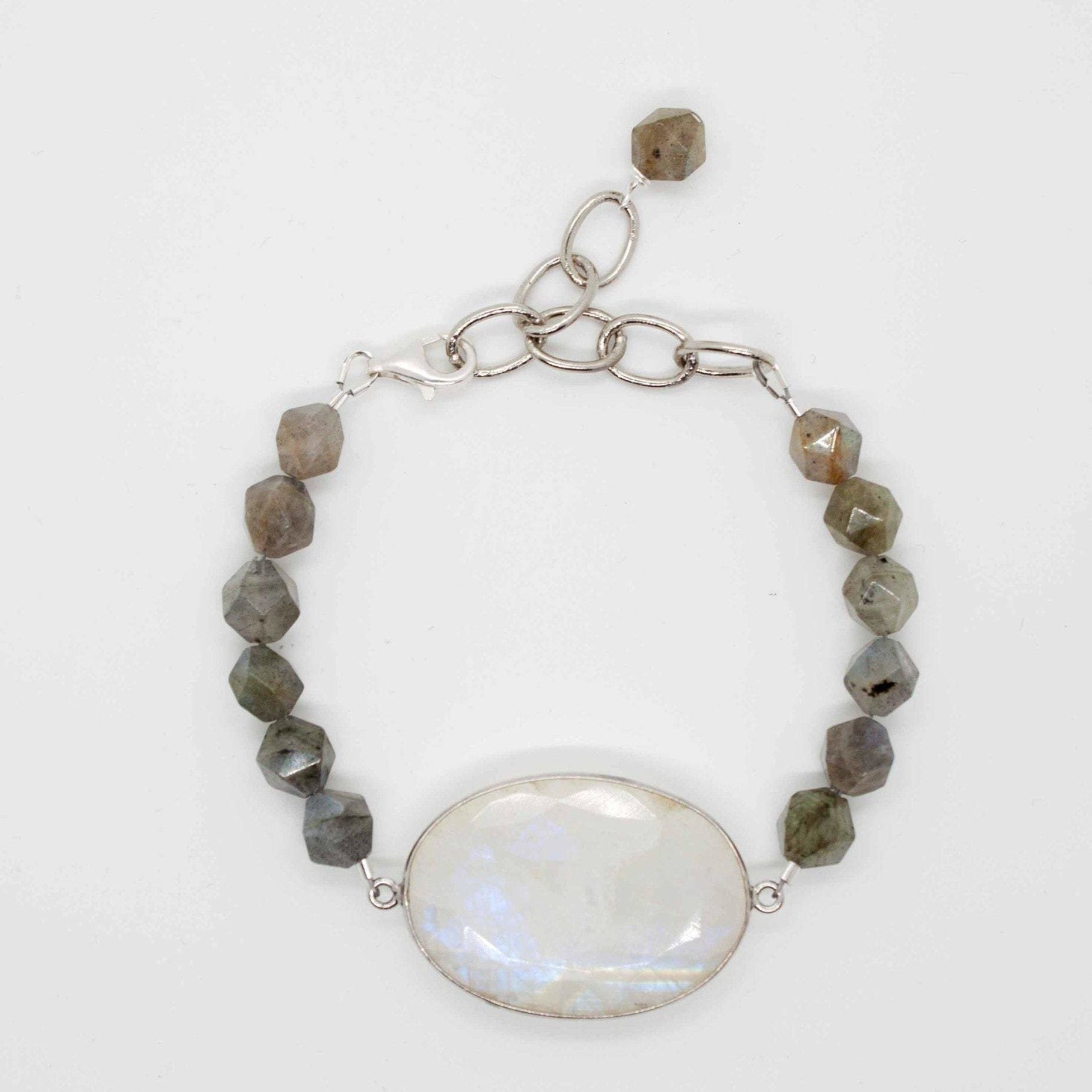 Cadence bracelet stack: 3 beaded bracelets made from labradorite, lava, hematite and sterling silver beads. Labradorite bracelet has large rainbow moonstone pendant and adjustable sterling silver lobster clasp.