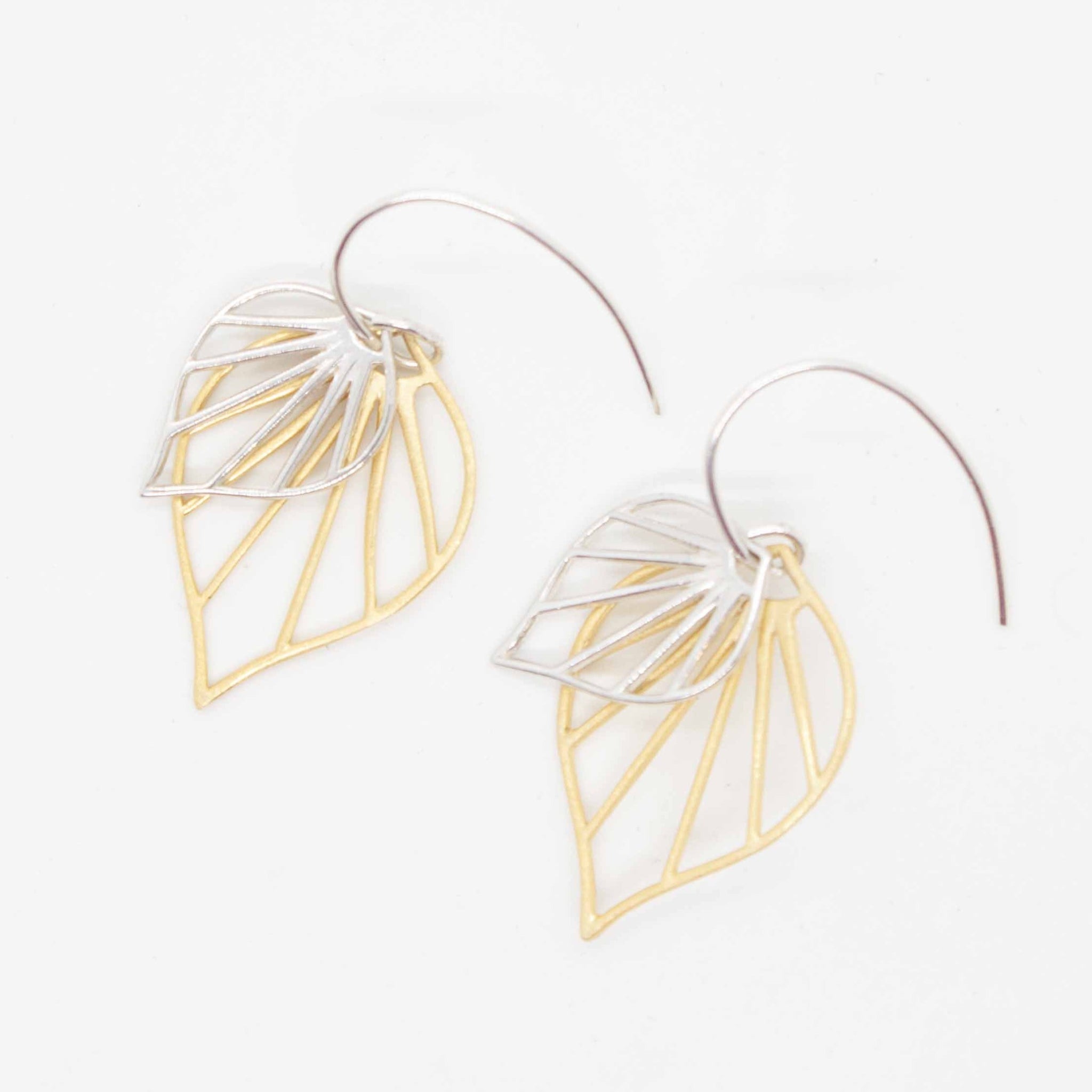 Summon the islands this summer with these voluptuous gold and silver palm leaves! 1 1/4 inch earrings, with gold vermeil & sterling silver palm charms on sterling silver earring hooks. Handmade in Toronto by kp jewelry co.