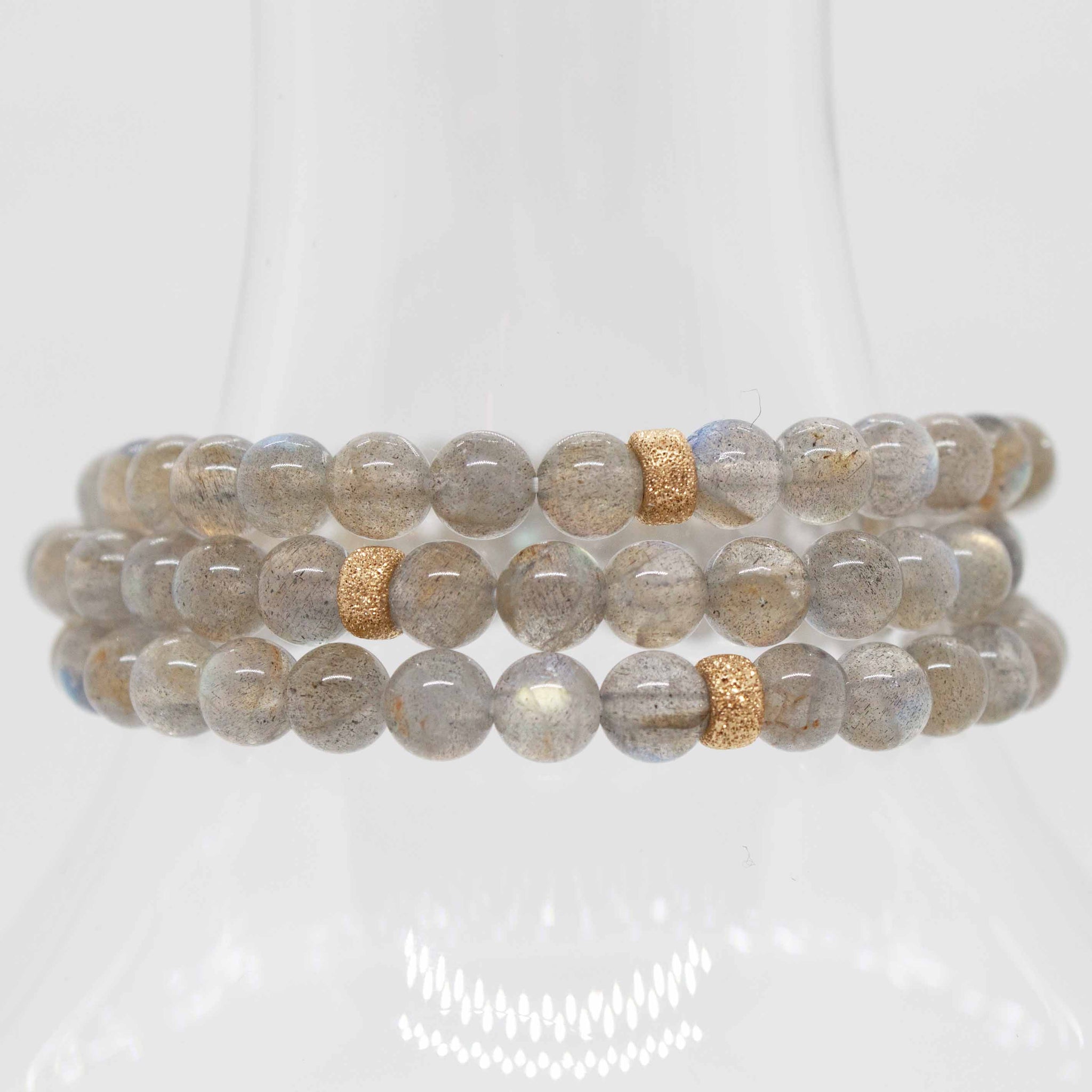 7 inch beaded labradorite stretchy bracelet with 14 karat gold accent bead, double strung with silk elastic.