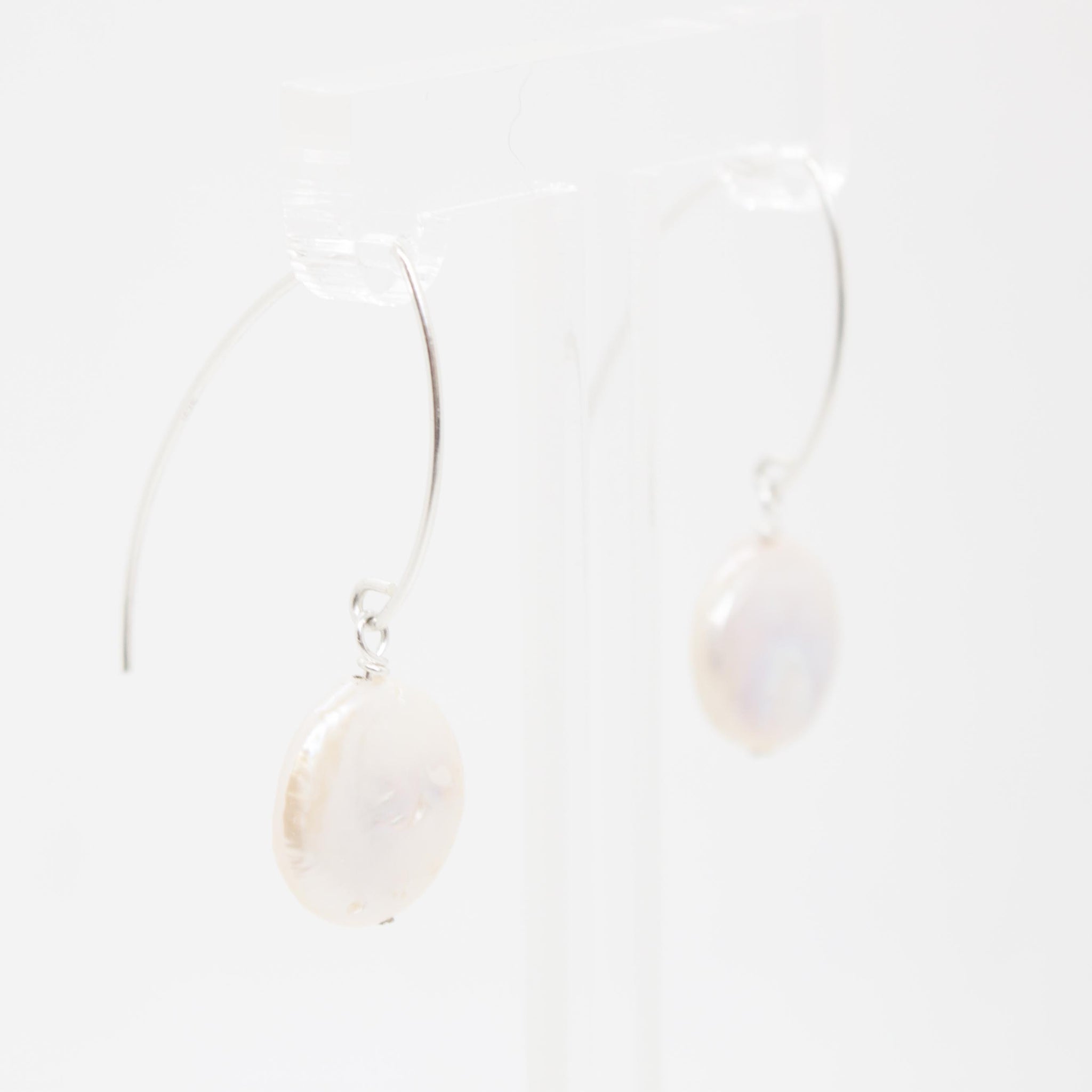 These versatile pearl earrings - along with their gold counterparts - are kp jewelry co.'s bestsellers! 1.5 inch keshi pearl earrings on sterling silver earring hooks (hypo-allergenic and sensitive-ear friendly). Handmade in Toronto by kp jewelry co.