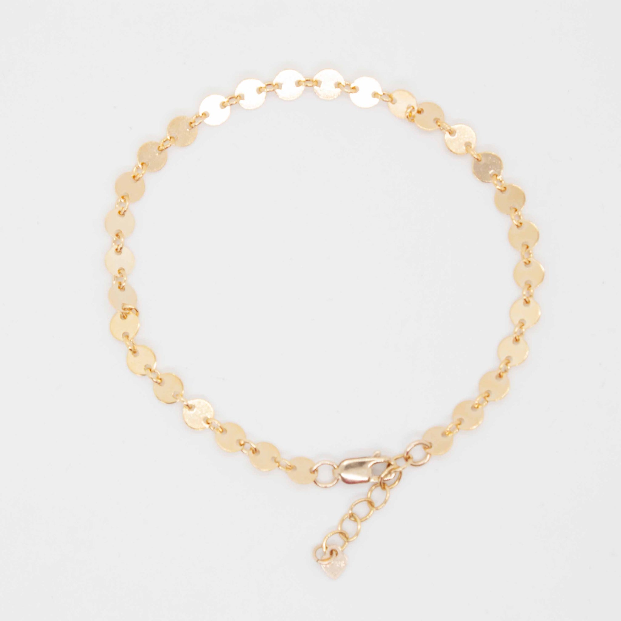 For LOVE of simplicity and classic elegance. 7 inch (adjustable) 14 karat gold filled* coin link chain *gold-filled jewelry is composed of a solid layer of gold, mechanically bonded to sterling silver. you are fine to shower in it, get it wet, wear it for life! Made in Toronto by kp jewelry co.