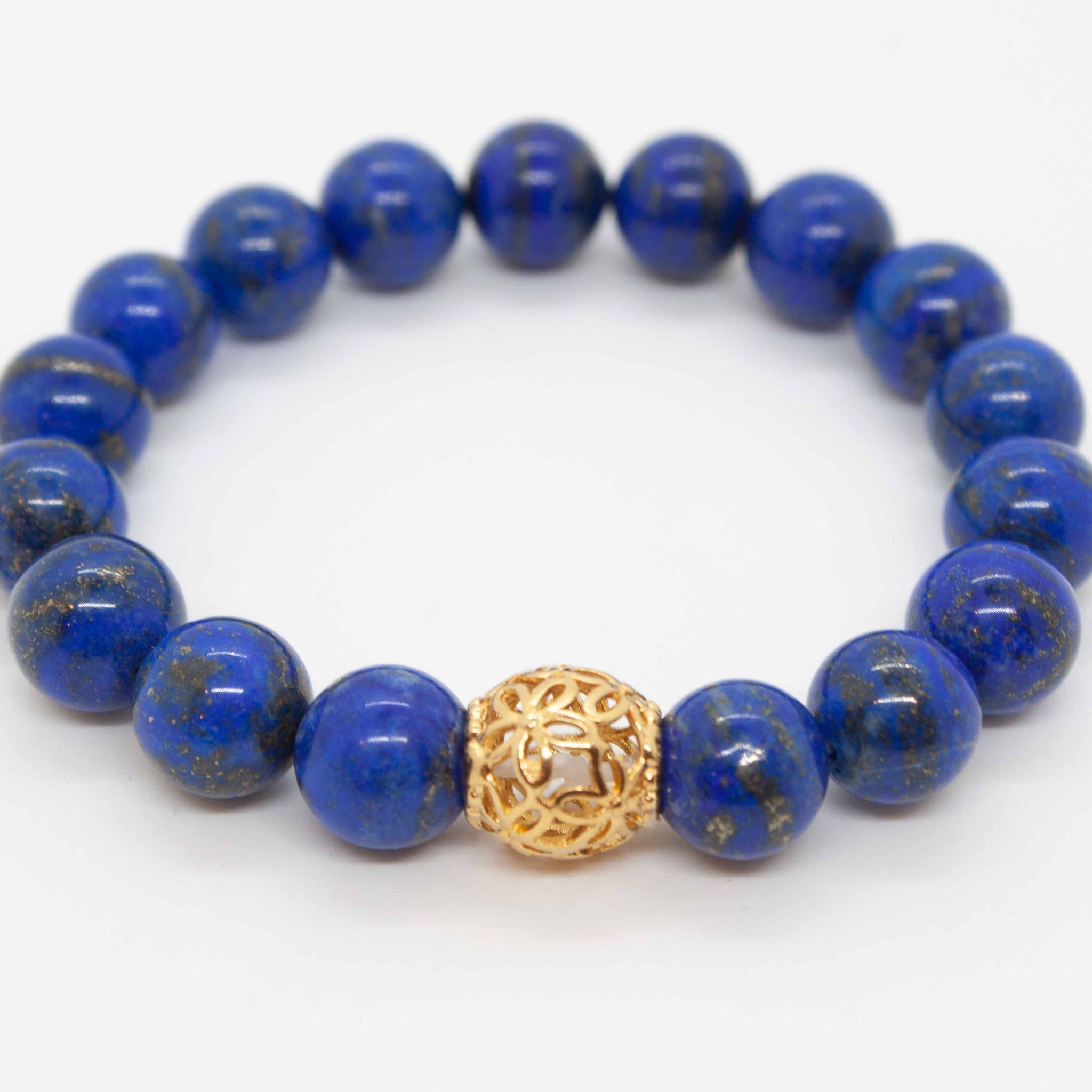 Calming and regal lapis lazuli and gold complement each other beautifully in this stunning bracelet. Want to connect to your royal presence? This bracelet is for you. Punch it up with our 14 karat gold filled bracelet! 7" lapis and gold beaded bracelet double strung on elastic silk thread (want a different size? send us an email!). 14kt gold filled beaded bracelet, also double strung on elastic silk thread. Made in Toronto by kp jewelry co.
