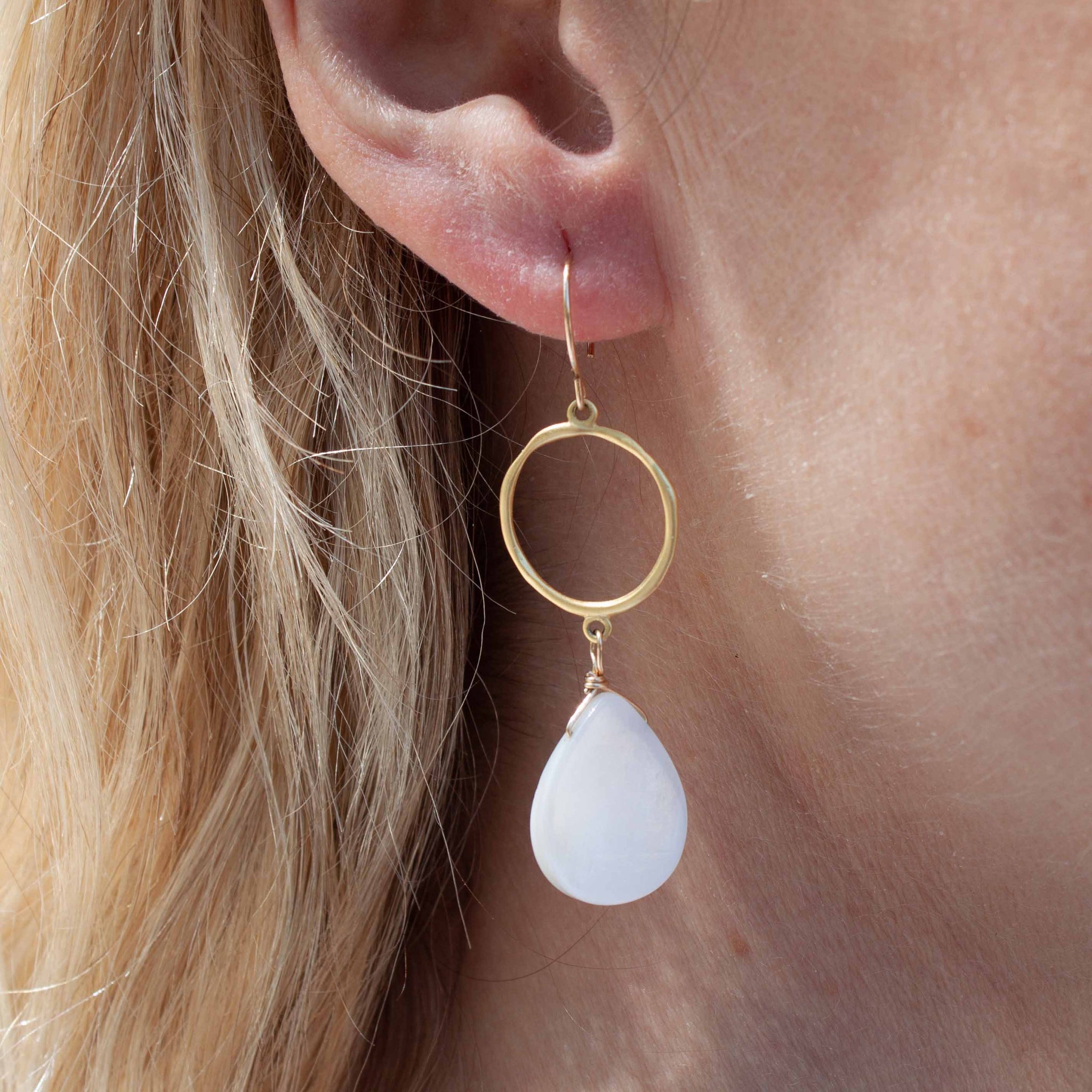 If we can't go tot he beach (yet!), let's at least feel like we're there! Put on these luscious shell earrings, crush yourself some mint and enjoy a mojito!  2" meringue shell earrings with gold vermeil circle charm and gold filled earrings hooks. Made in Toronto by kp jewelry co.