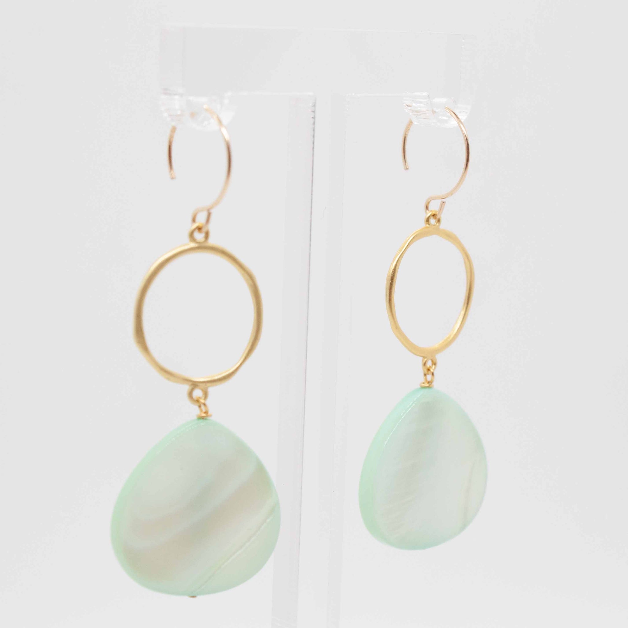 If we can't go to the beach (yet!), let's at least feel like we're there! Put on these luscious shell earrings, crush yourself some mint and enjoy a mojito!  2" mint shell earrings with gold vermeil circle charm and gold filled earrings hooks. Made in Toronto by kp jewelry co.