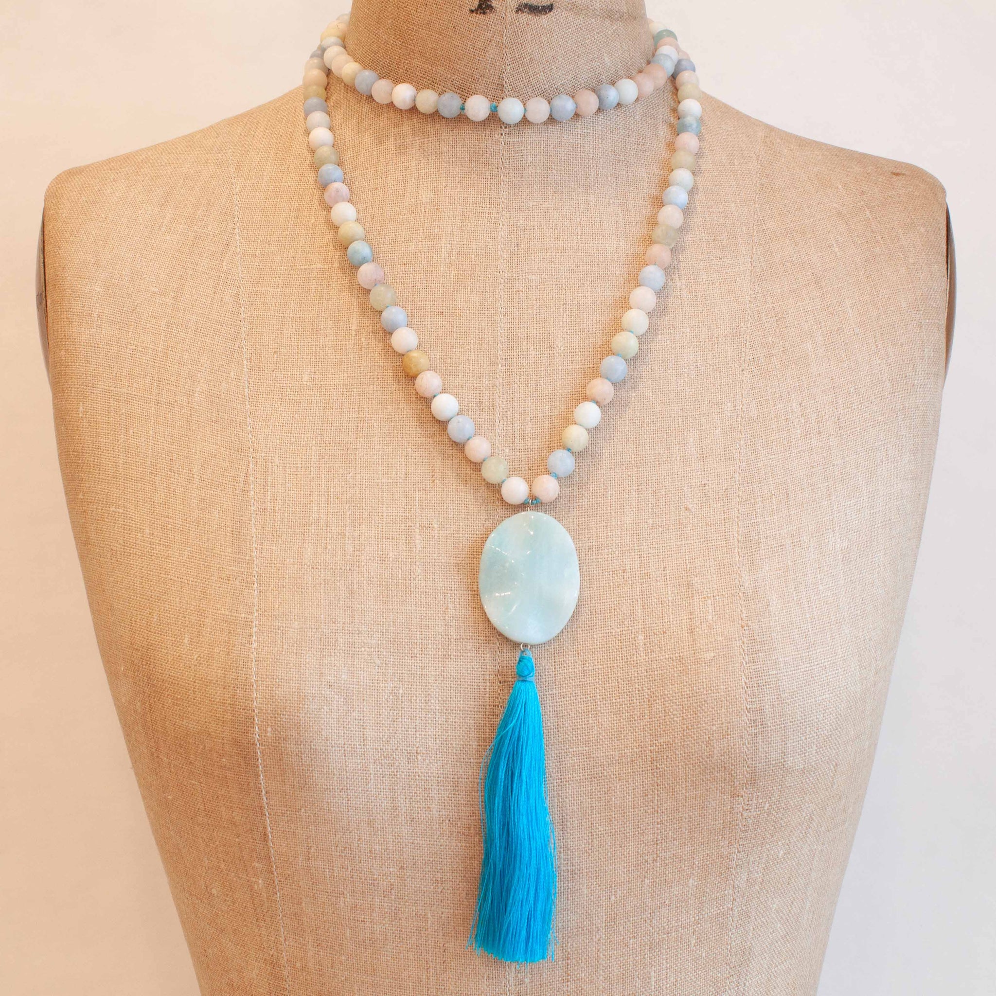 Our loving mala was hand knotted in our Toronto studio using morganite and aquamarine. Wear it to bring healing and compassion into your life; also a beautiful addition to your meditation practise. 40 inches long, 108 hand knotted morganite beads with aquamarine pendant and sky blue tassel. Handmade in Toronto kp jewelry co.