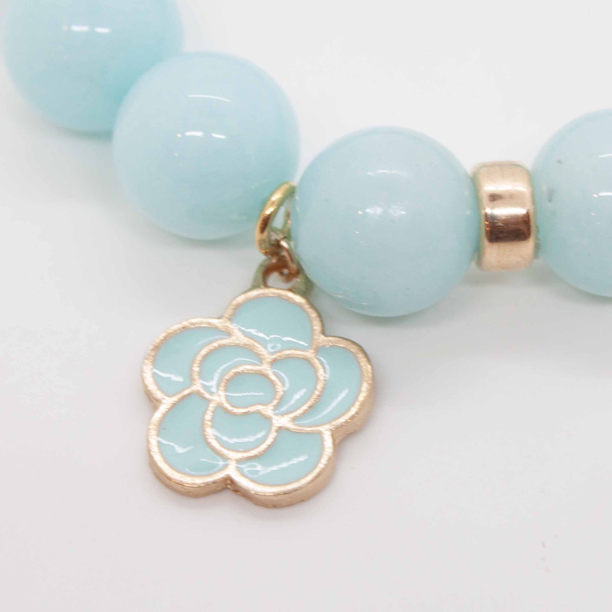 The beloved morning glory vine produces round sky blue flowers. For the gardener in your life! Or wear as a reminder of the glory of each new day.  Aqua jade beads with gold filled accents and morning glory charm. Double strung with silk elastic. Handmade in Toronto by kp jewelry co. 