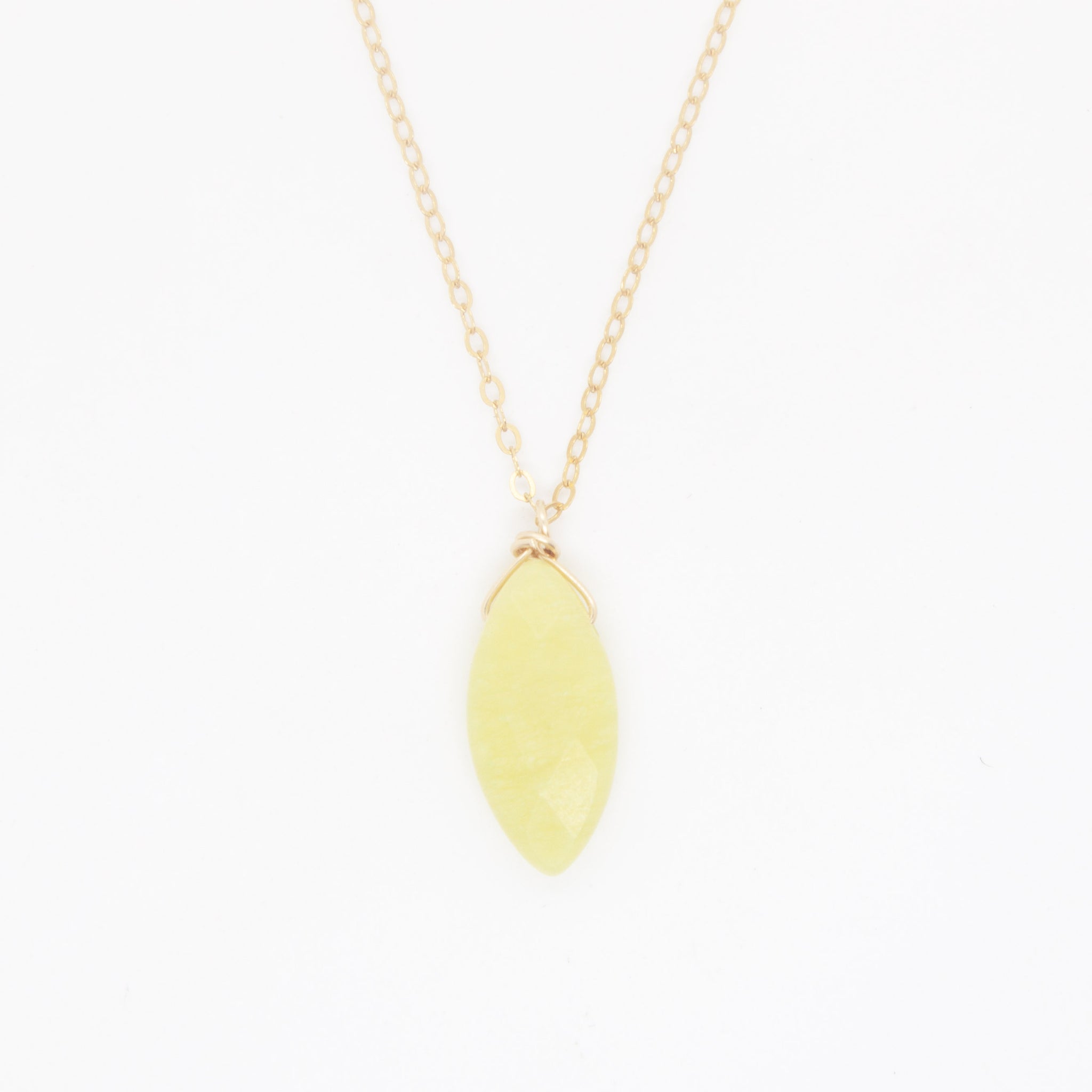 A unique 'pop' of lemon-lime colour to complement your summer whites (or blues, or pinks, or yellows....)! Gold filled necklace with olive jade charm, wrapped in 14 karat gold wire. Handmade in Toronto by kp jewelry co.