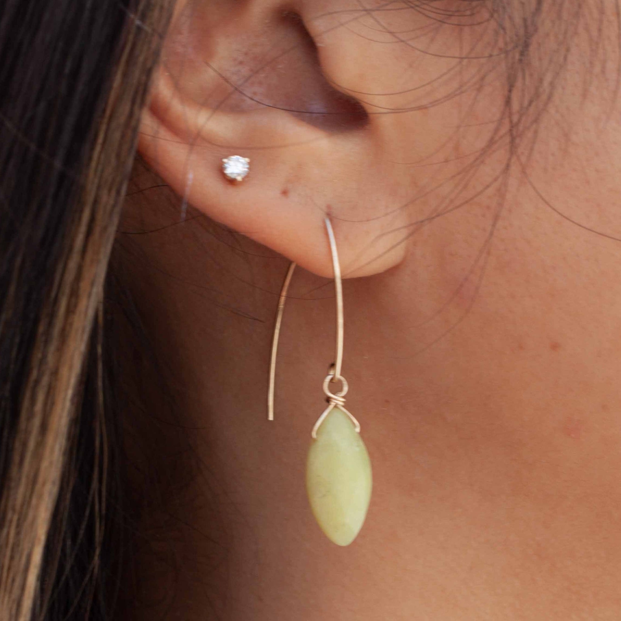 These gold and olive jade earrings are the perfect pop of colour for hot summer days. Pair with our olive jade statement necklace for a bold assertion of your summer beauty! 1 3/4 inch olive jade drop earrings on 14 karat gold filled* earring hooks (hypo allergenic and sensitive ear friendly). Handmade in Toronto by kp jewelry co. *gold-filled jewelry is composed of a solid layer of gold, mechanically bonded to sterling silver. You are fine to shower in it, get it wet, wear it for life! 