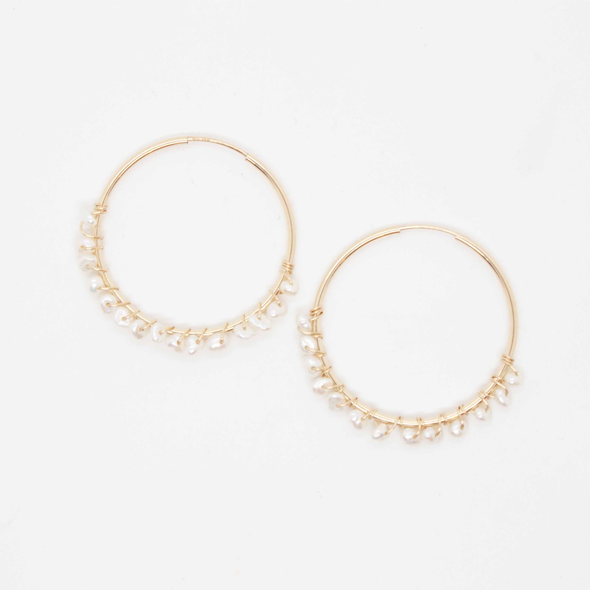 30mm gold filled sleeper hoops, with white pearls wrapped with gold wire.