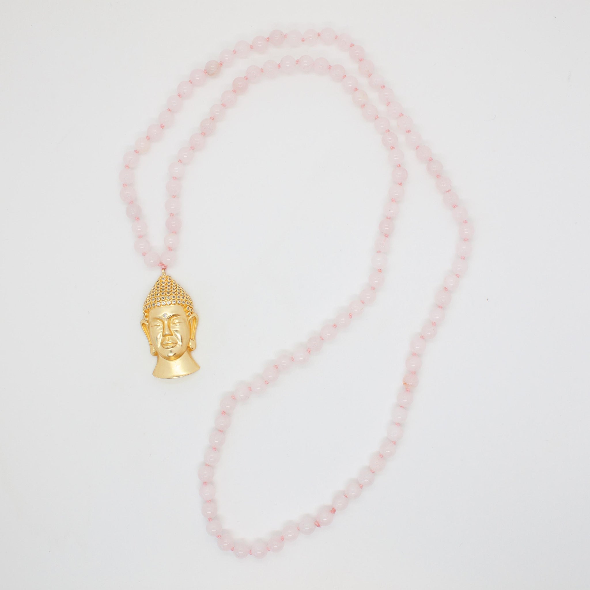 For LOVE of opening your heart to promote self-love, friendship, deep inner healing and feelings of peace. 30 inch hand knotted rose quartz mala (108 beads) with silver and gold buddha pendant. Handmade in Toronto kp jewelry co.