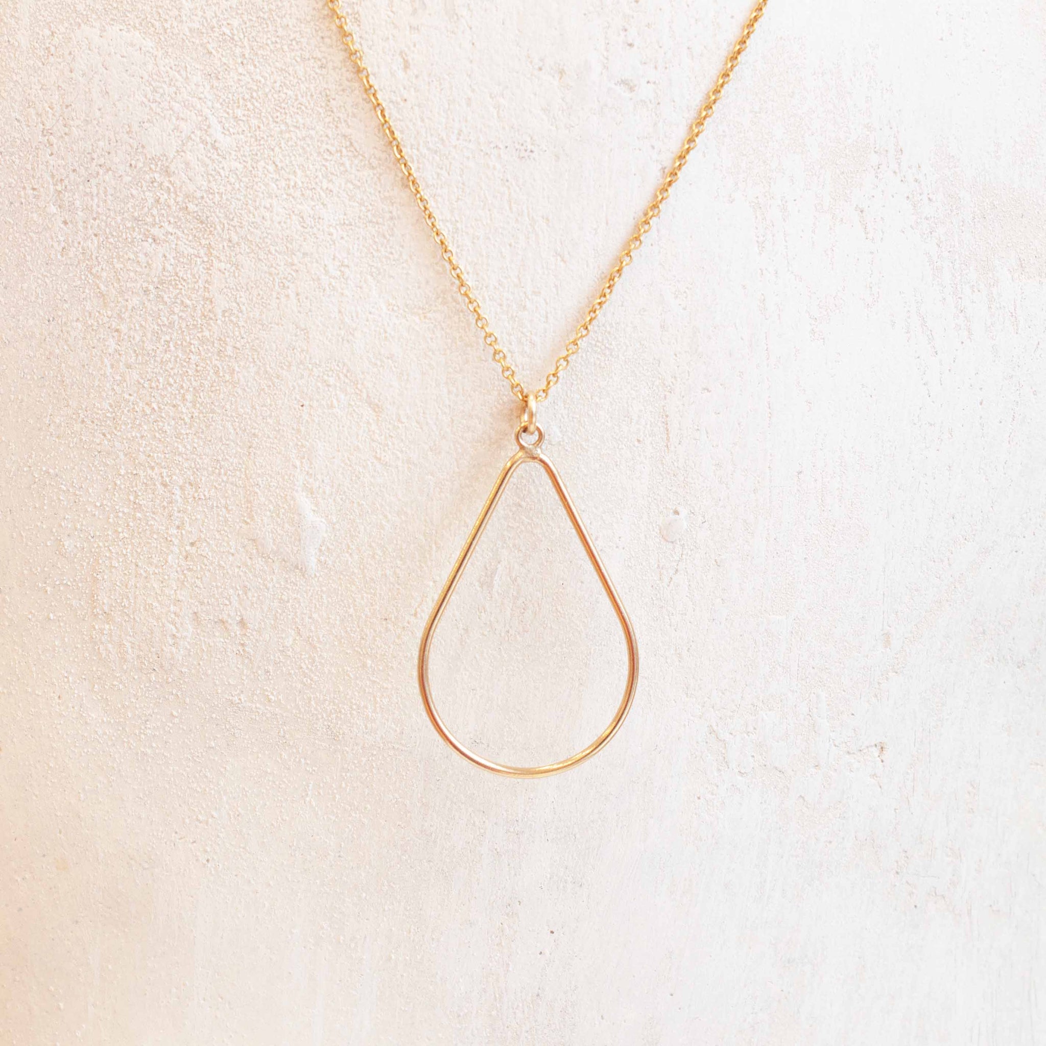 A modern shape to freshen up your everyday necklace! 16, 18 or 20 inch gold filled necklace with 1 1/4 inch gold filled teardrop pendant. Handmade in Toronto by kp jewelry co.