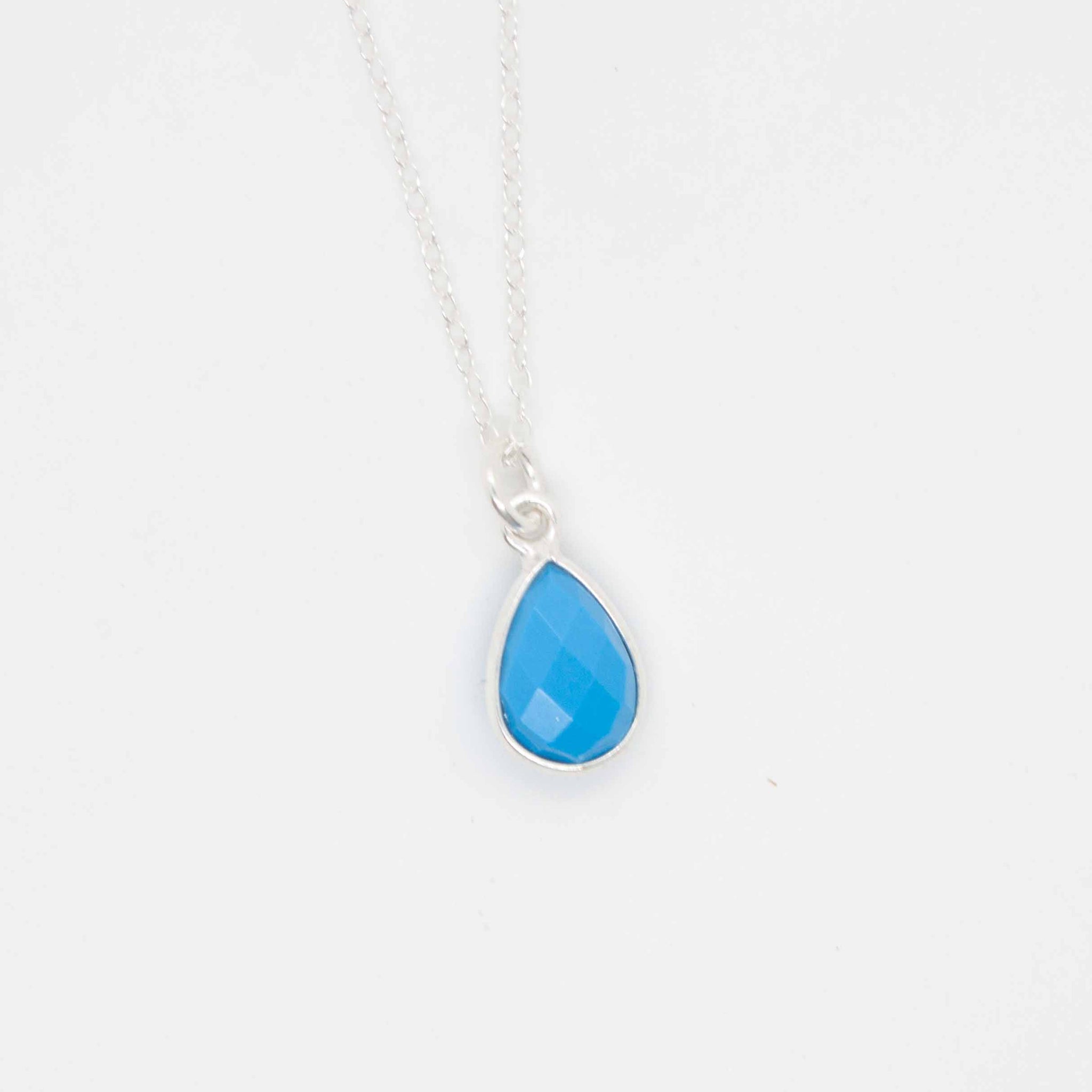 Great for an everyday pop of colour, treat yourself to this dainty and vibrant turquoise and silver drop necklace. synthetic* turquoise beads with sterling silver bezel & chain. Handmade in Toronto by kp jewelry co. *synthetic turquoise is a cost-efficient and sustainable alternative to the real thing.