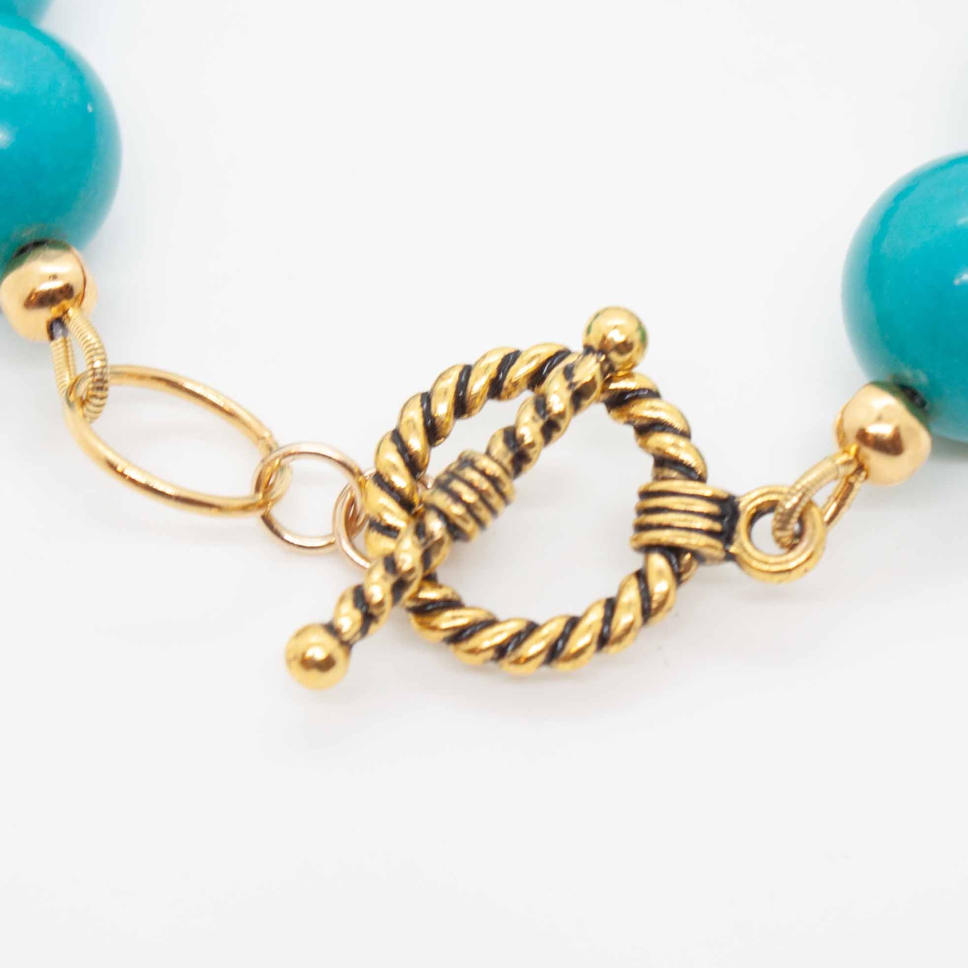 Turquoise and gold offset each other beautifully in this bold statement bracelet. Synthetic* turquoise beads with brass and gold filled accents. Handmade in Toronto by kp jewelry co.  * Synthetic turquoise is a cost-efficient and sustainable alternative to the real thing.  