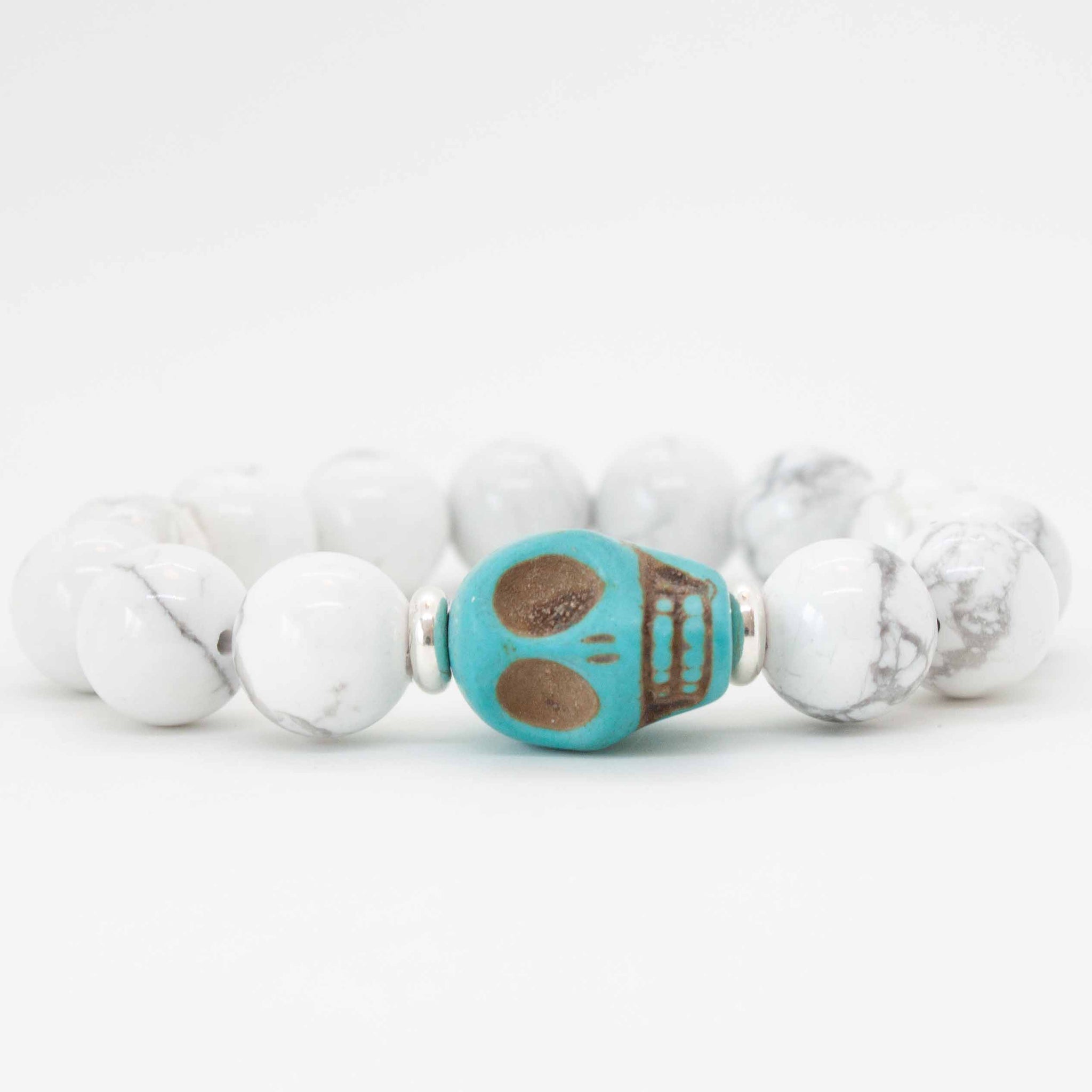 Bright colour a some fun white howlite and a turquoise skull bead. Come on and get edgy, girl! 7 inch beaded white howlite stretchy bracelet with turquoise skull bead, double strung with silk elastic cord. Handmade in Toronto by kp jewelry co.